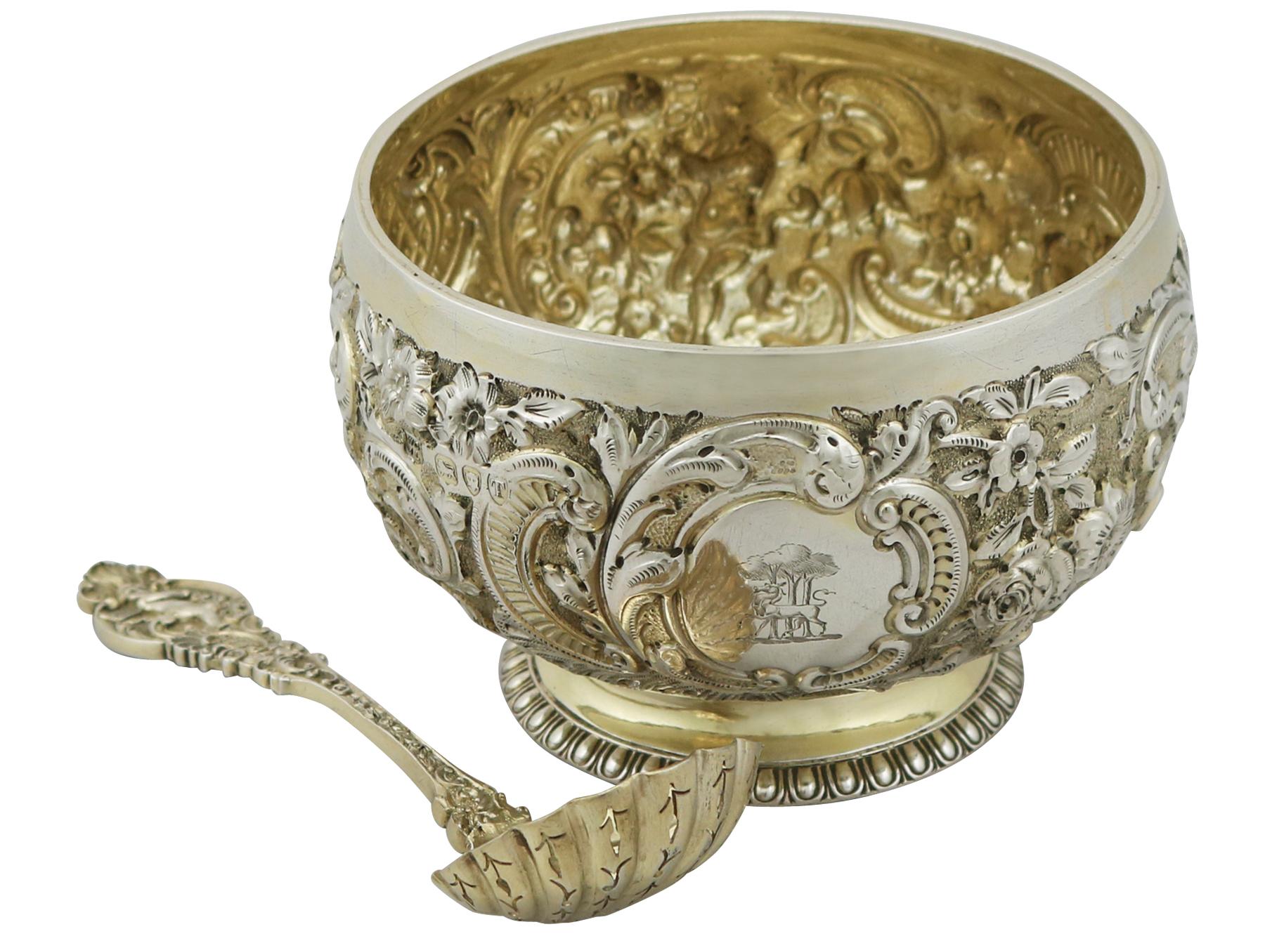 An exceptional, fine and impressive antique Victorian English sterling silver sugar sifter spoon and bowl - boxed; an addition to our silver teaware collection.

This exceptional antique Victorian sterling silver gilt teaware set consists of a
