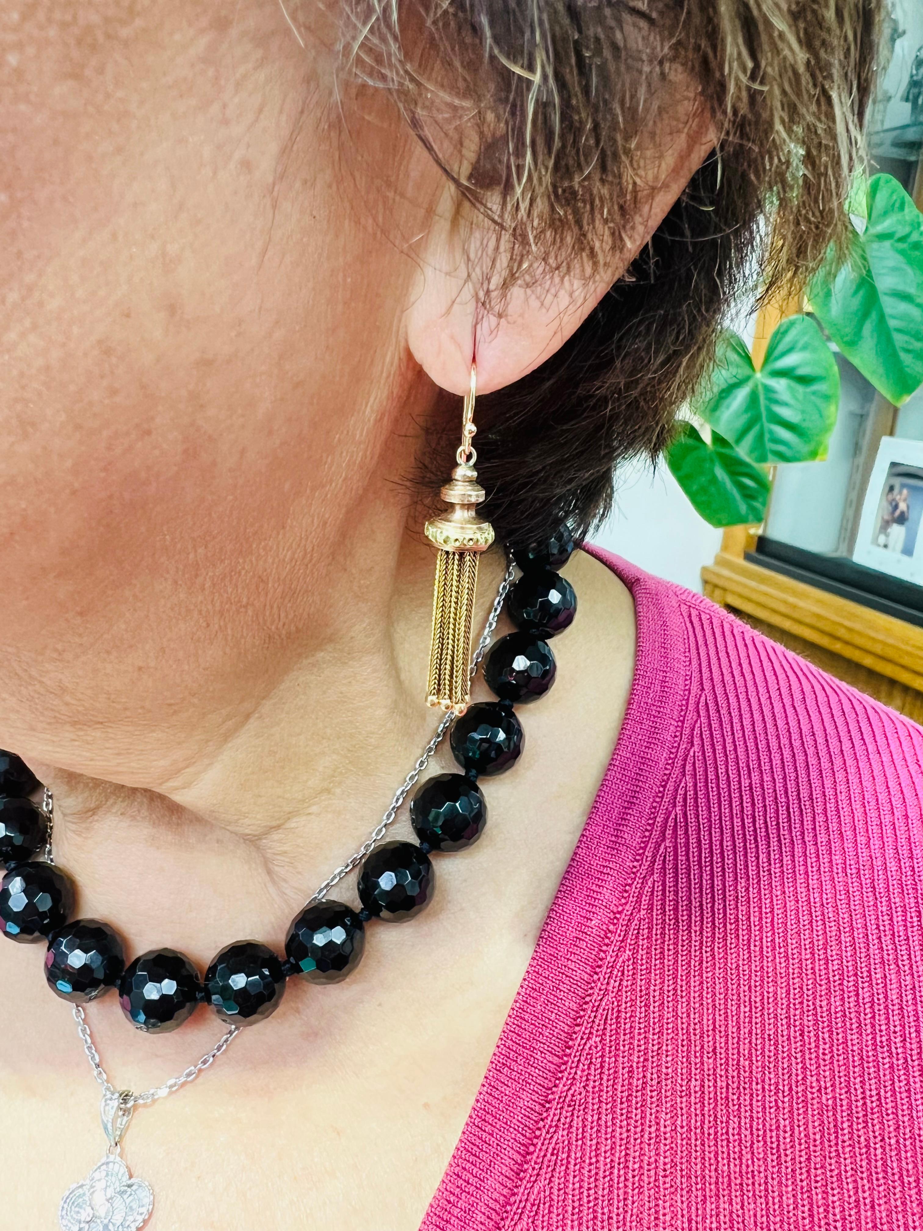 . 1890s Victorian 14k Yellow Gold Tassle Dangle Earrings.

The Victorian 14k Yellow Gold Tassle Dangle Earrings were made around the 1890s.  These exquisite earrings reflect the intricate craftsmanship of the era.  Characterized by their use of