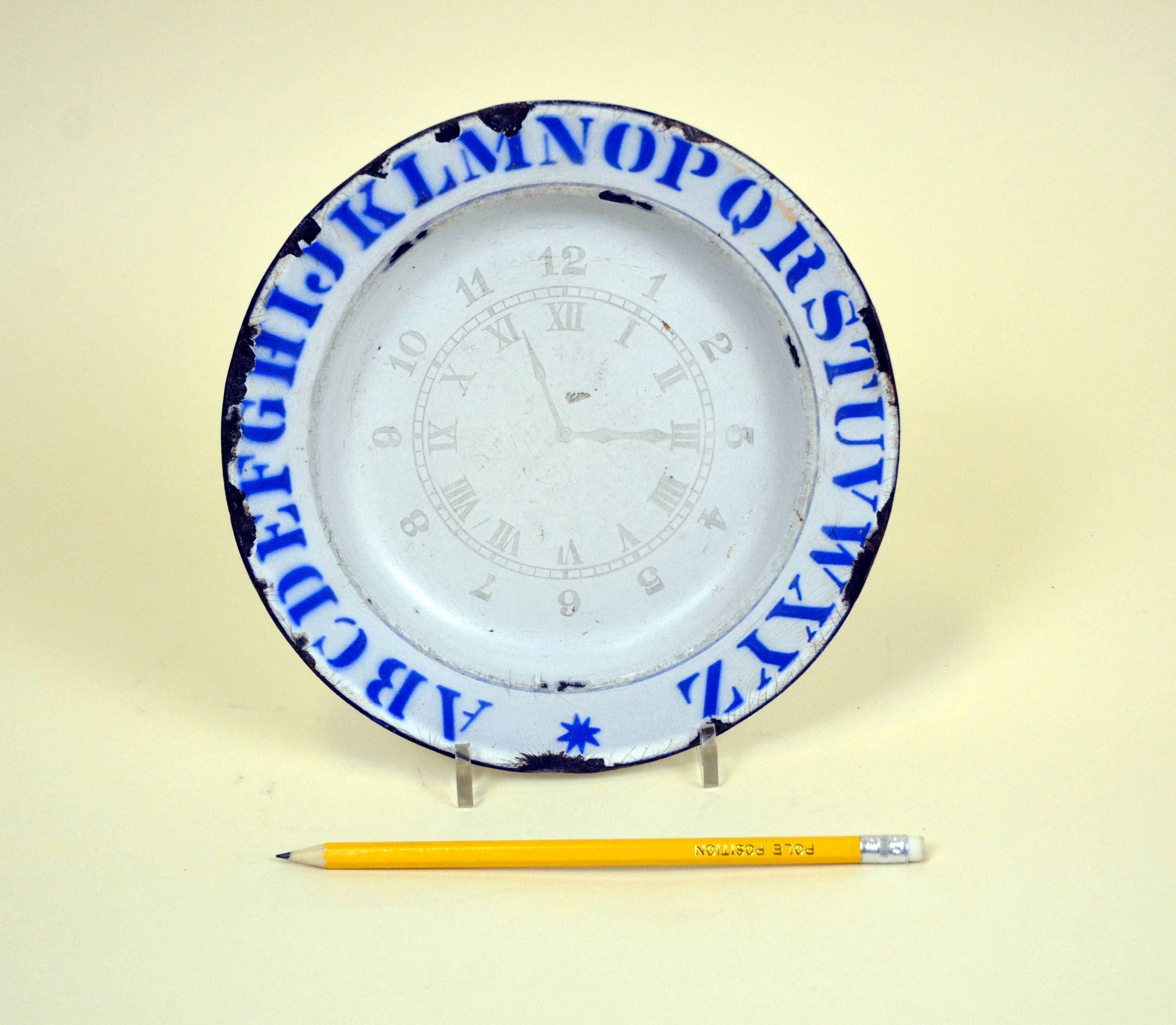 Vintage enamel ware ABC Plate with Clock and Numbers made for kids in England in 1890c.
