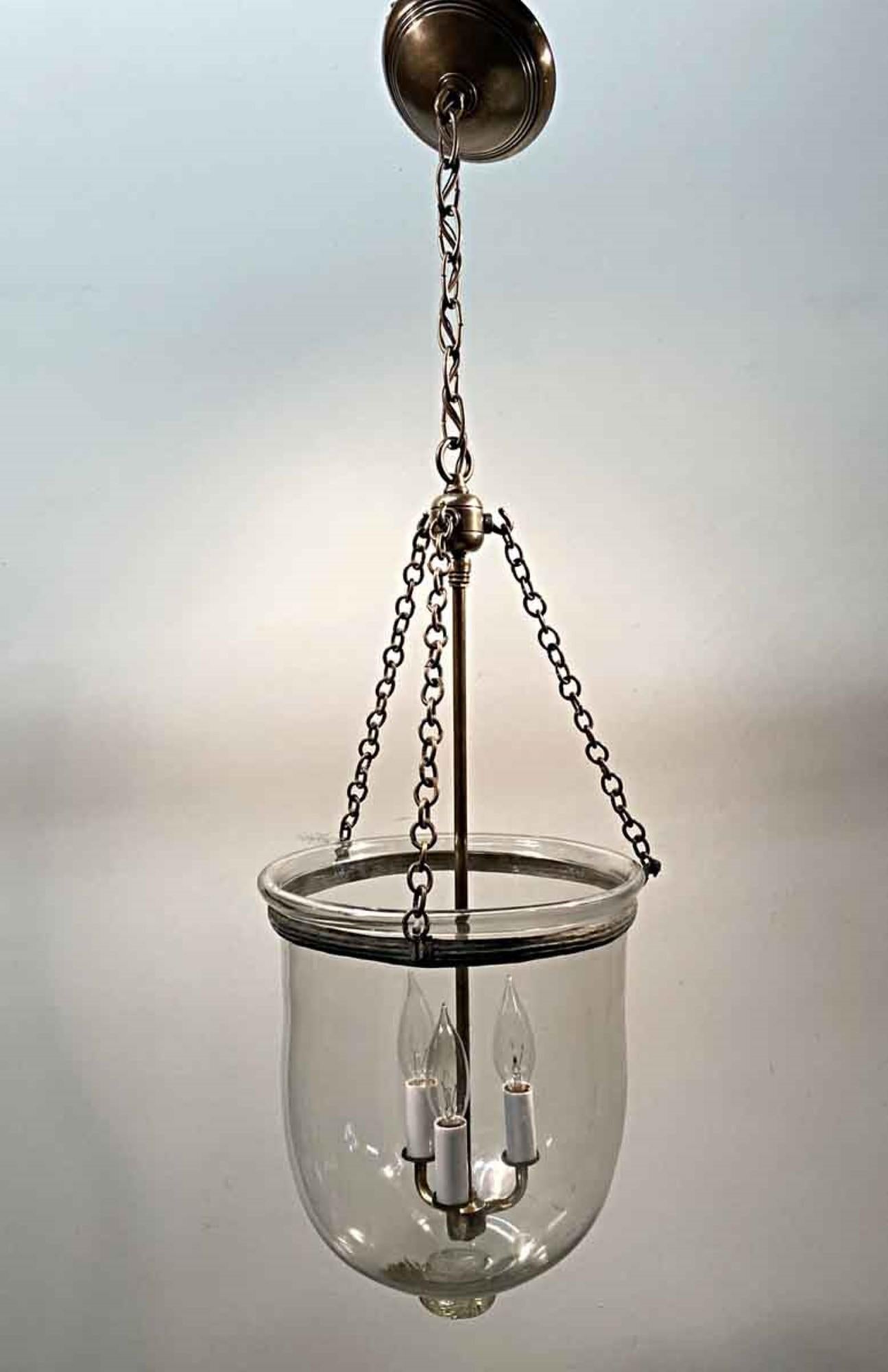 1890s English hand blown glass bell jar lantern with clear glass, newly made brass hardware. Features three candelabra lights. Price includes restoration. This can be seen at our 400 Gilligan St location in Scranton. PA.