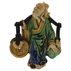 Souvenir dell'Esposizione Universale Cinese del 1891-1911 con figura dell'uomo di fango