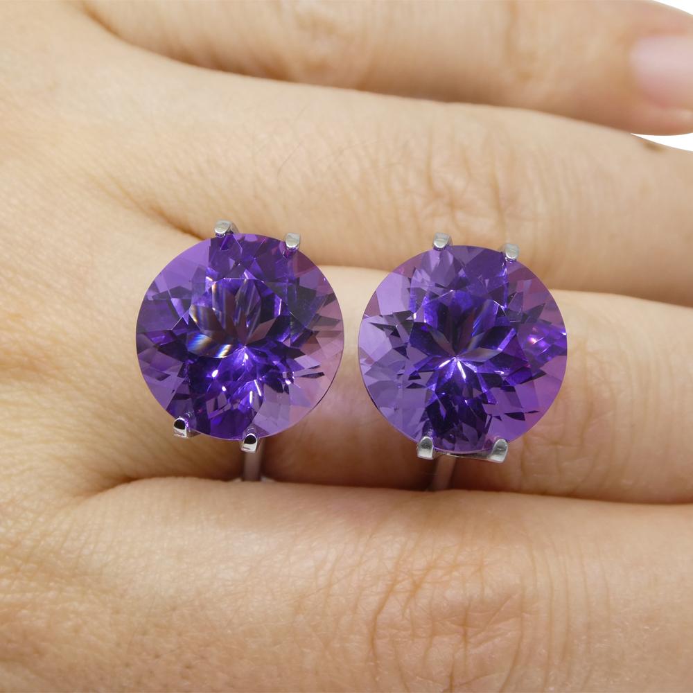 Description:

Gem Type: Amethyst
Number of Stones: 2
Weight: 18.94 cts (9.14 ct/9.75 ct)
Measurements: 13.98 x 13.96 x 9.52 mm / 13.97 x 13.99 x 10.26 mm
Shape: Round
Cutting Style:
Cutting Style Crown: Brilliant Cut
Cutting Style Pavilion: