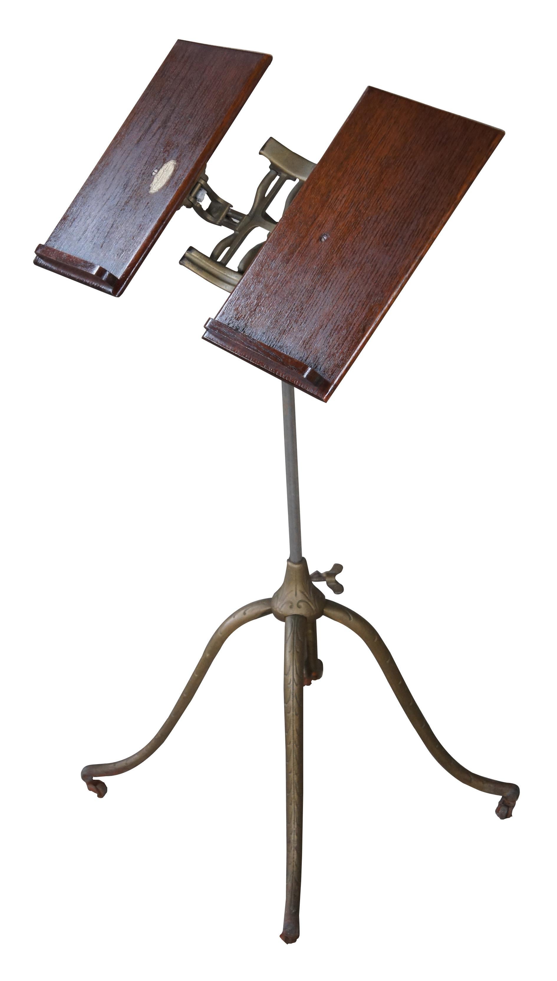 Antique adjustable Columbia Dictionary library stand by Josiah Anstice & Co of Rochester New York featuring ornate wrought iron pedestal base and quartersawn oak book holder. Circa 1895.

Measures: 24
