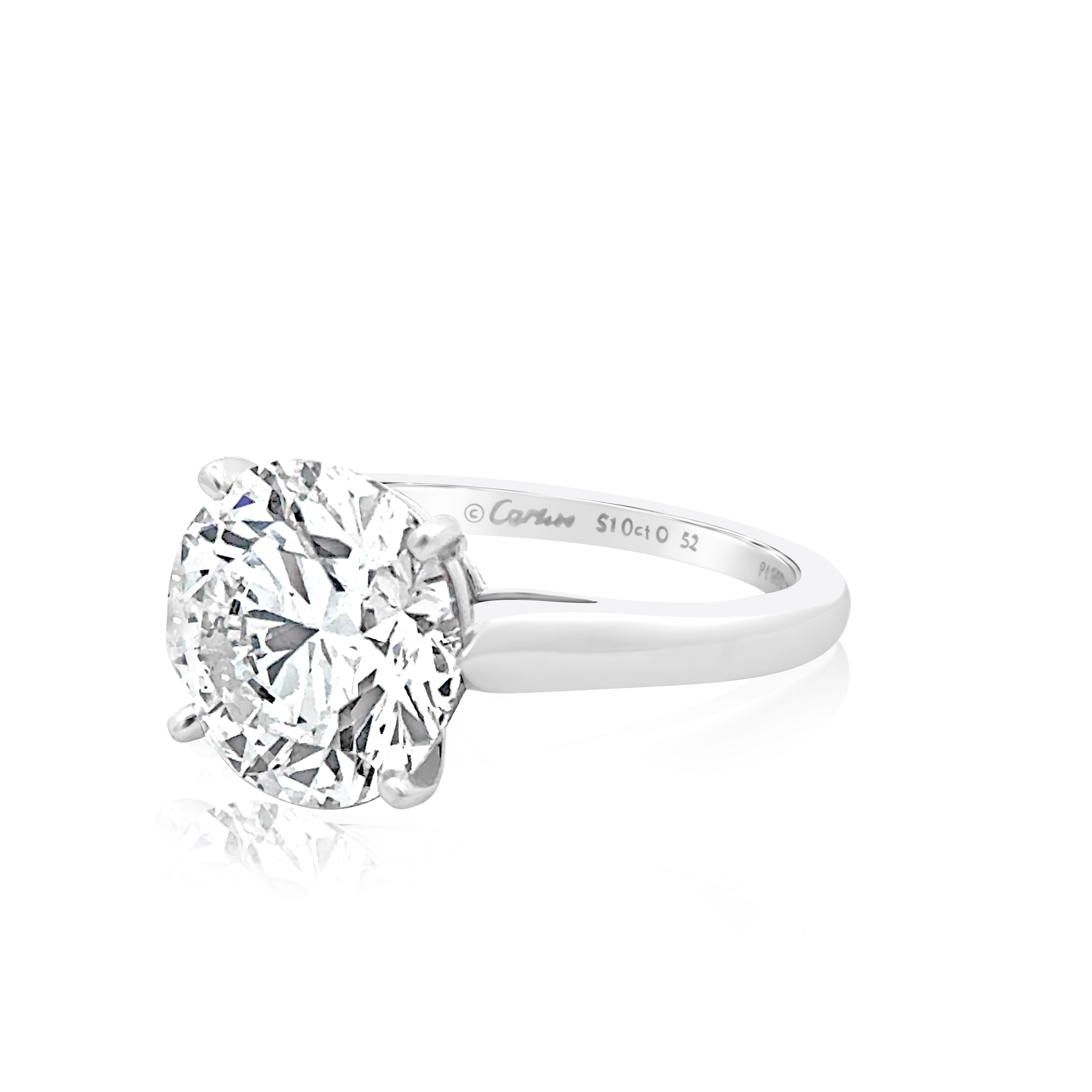 A stunning Cartier engagement ring, featuring a 5.10 carats round brilliant cut diamond, set on a classic four prong setting. Finely made with a platinum mounting. Diamond is certified by GIA as E color and VVS2 clarity with excellent cut, polish,