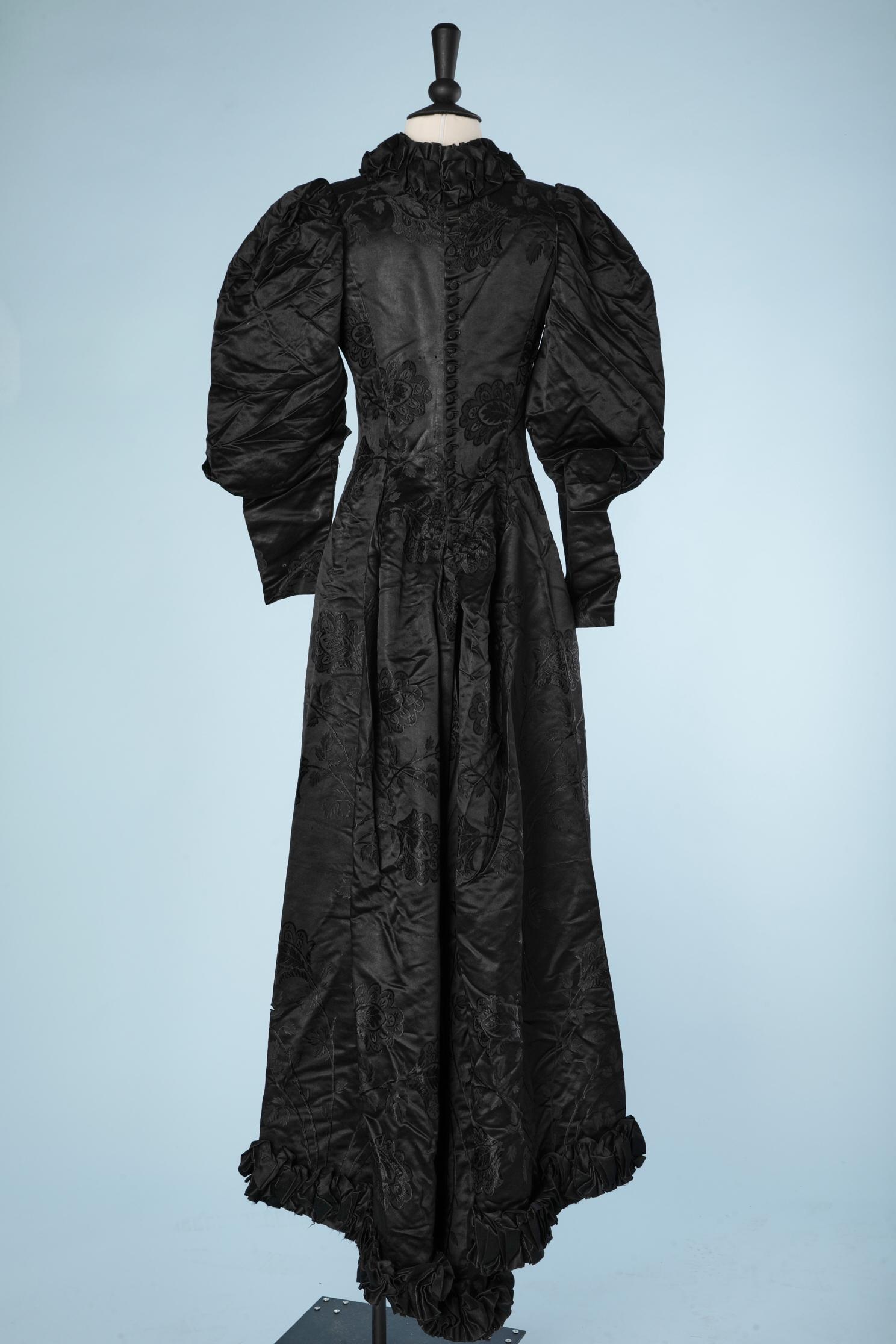 Women's 1898 Black damask silk dress with ruban ruffles around neck and bottom edge 