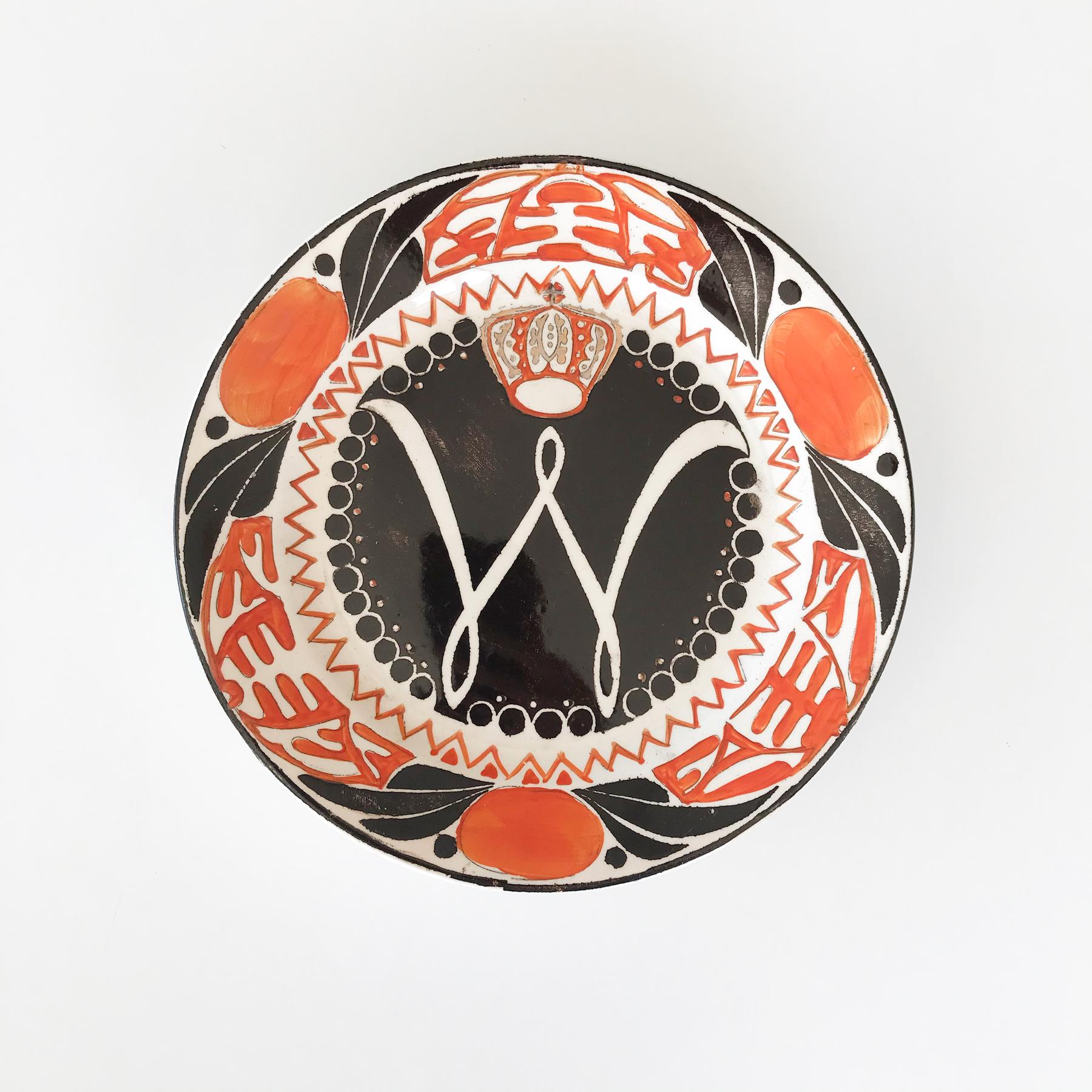 Wonderfully graphic wall plates with stencilled and hand painted design in orange, black and gold commemorating the coronation of Queen Wilhelmina of the Netherlands in 1898.

Great wall decor item for either domestic or hospitality use. It would