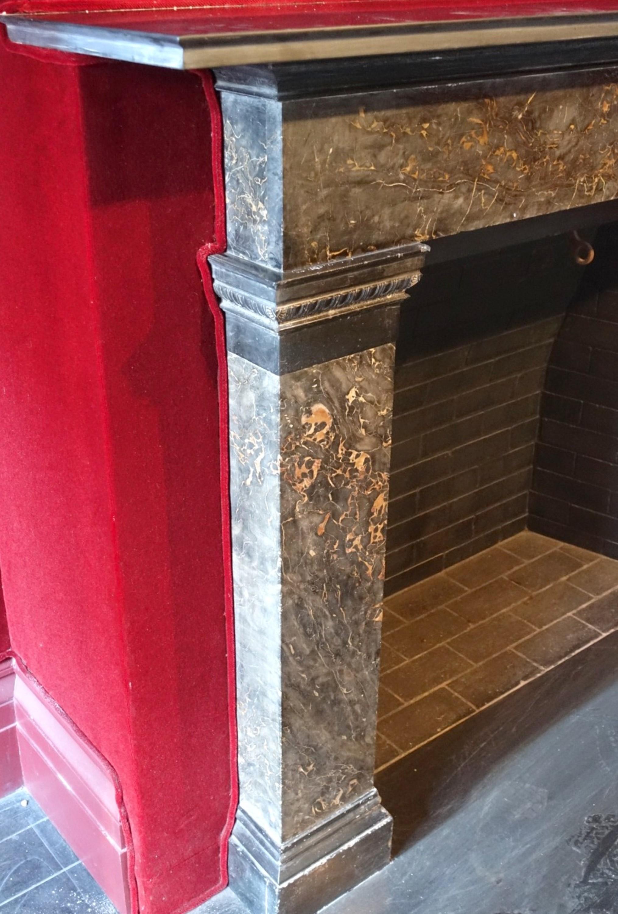 Recovered from a very prominent 1899 townhouse in the West Village on West 11th Street, Manhattan, NY, this mantel has a classic design with simple but elegant details. The vertical columns are solid and seamless slabs of Italian Portoro Marble that