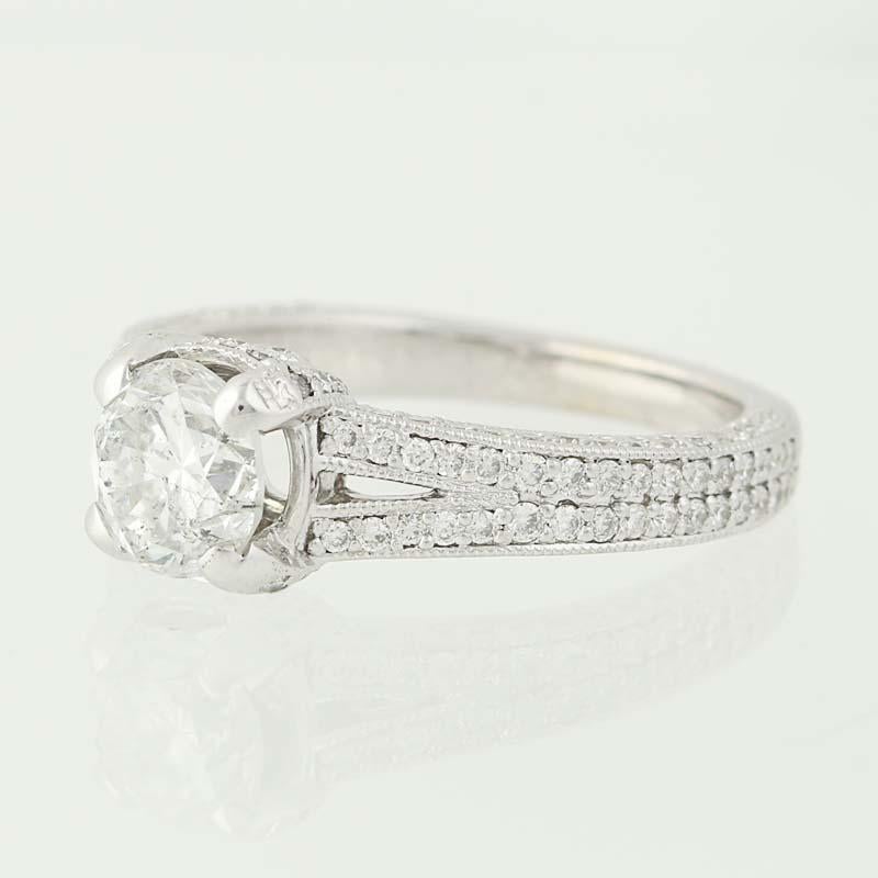Dreams come true with this gorgeous engagement ring! Fashioned in popular 14k white gold, this stunning piece features a GIA-certified, laser-drilled diamond solitaire with an impressive 1.14 carat weight. Diamond accents bordered in milgrain