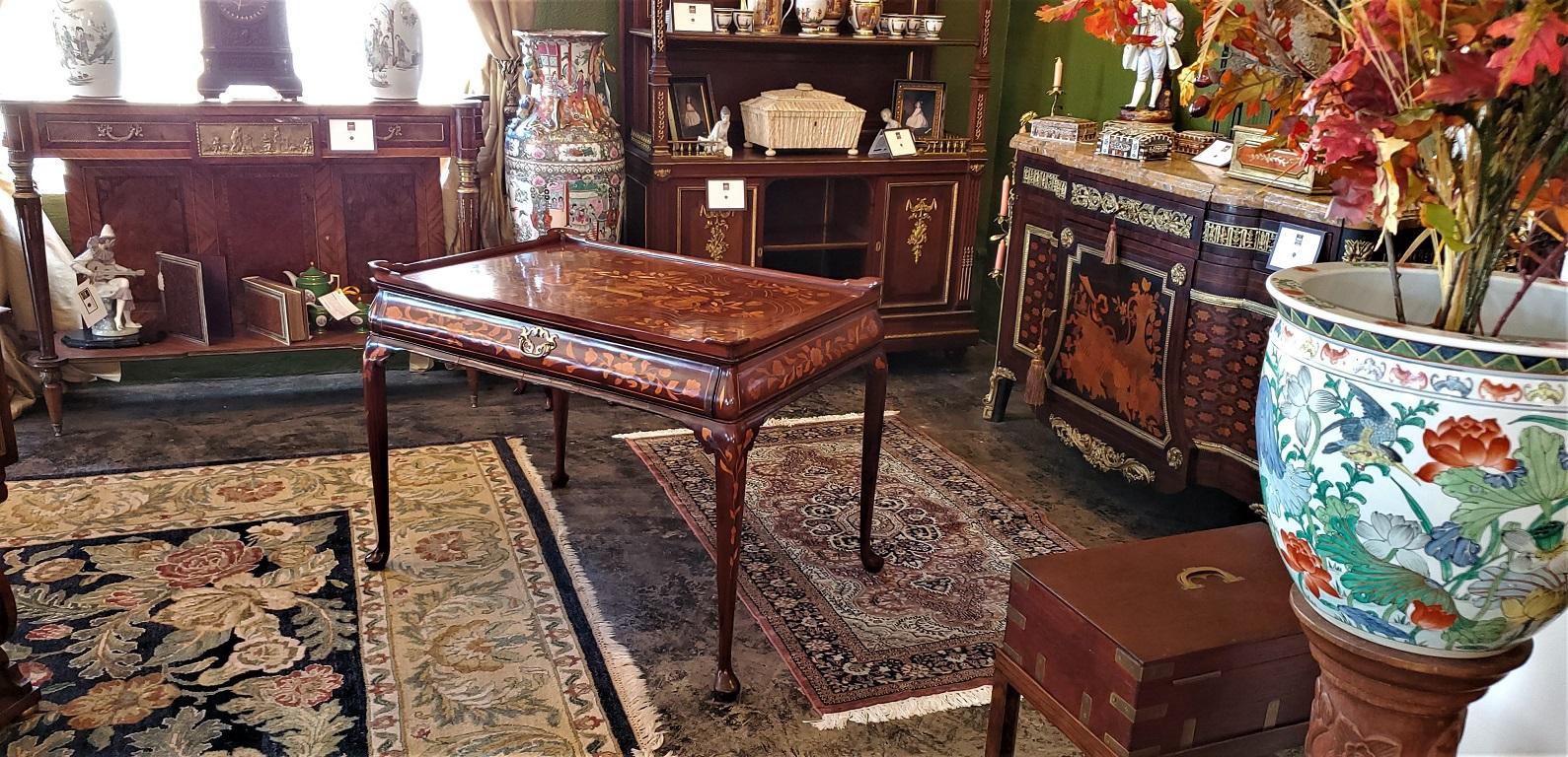 Presenting an absolutely stunning and exceptional 18th century Dutch Marquetry silver table.

Made in the Netherlands circa 1780, the silver table is made of walnut and rosewood with profuse marquetry inlays in satinwood, kingwood and hare wood,