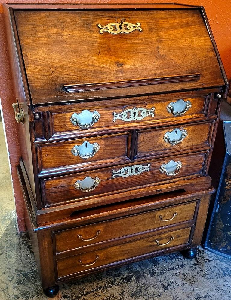 PRESENTING A GORGEOUS and beautifully proportioned Mid-18th Century George II Miniature Campaign Bureau Chest on later Chest/Stand.

Mid-18th century, made in Britain, circa 1760-1770.

The bureau chest sits on a later stand/chest, that we estimate