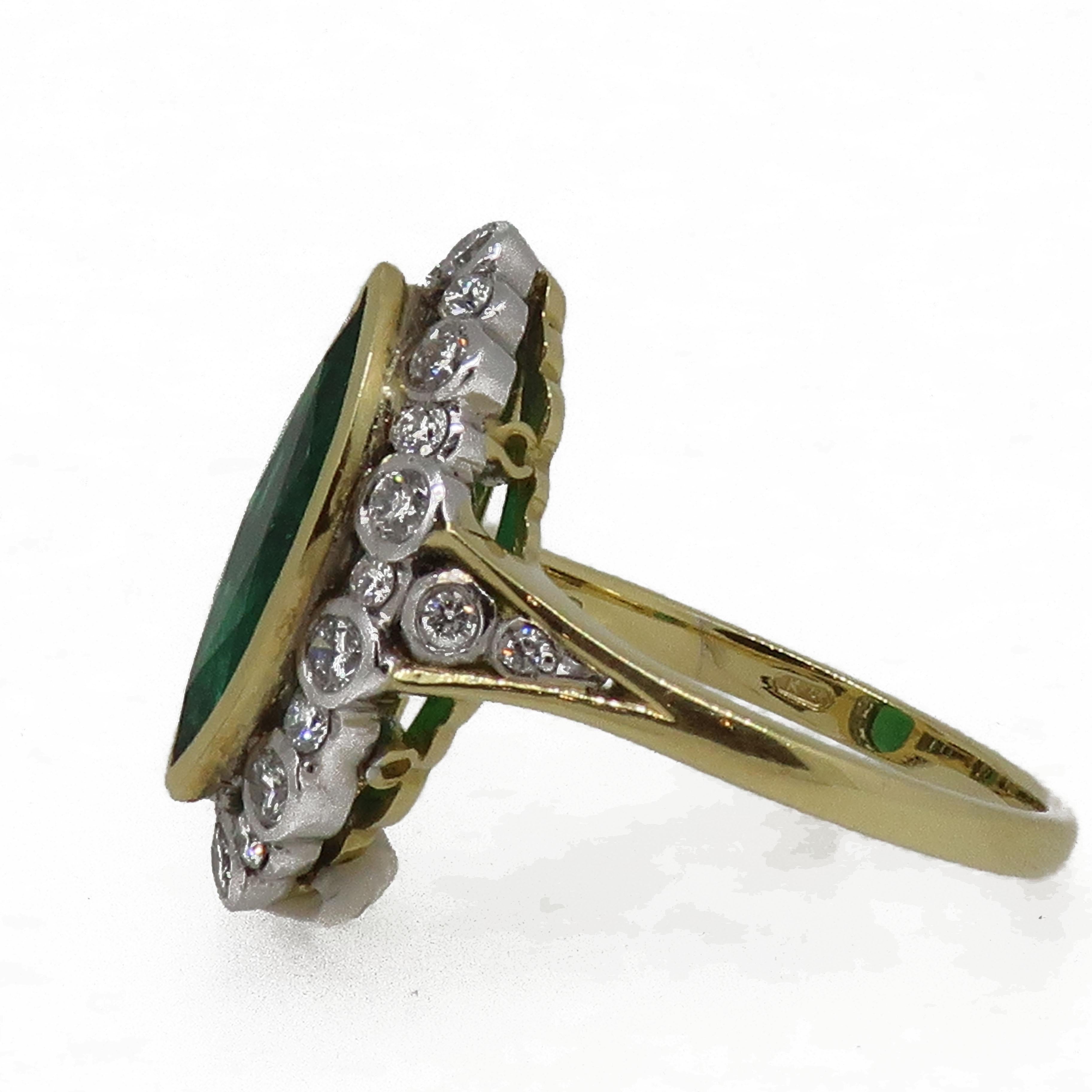 18Carat Gold Marquise Navvette Cut Emerald & Diamond Art Deco Style Cluster Ring.

A truly mesmerising marquise cut green Columbian emerald set in a fine yellow gold bezel weighing 2.25ct, surrounded by white brilliant cut diamonds all set
