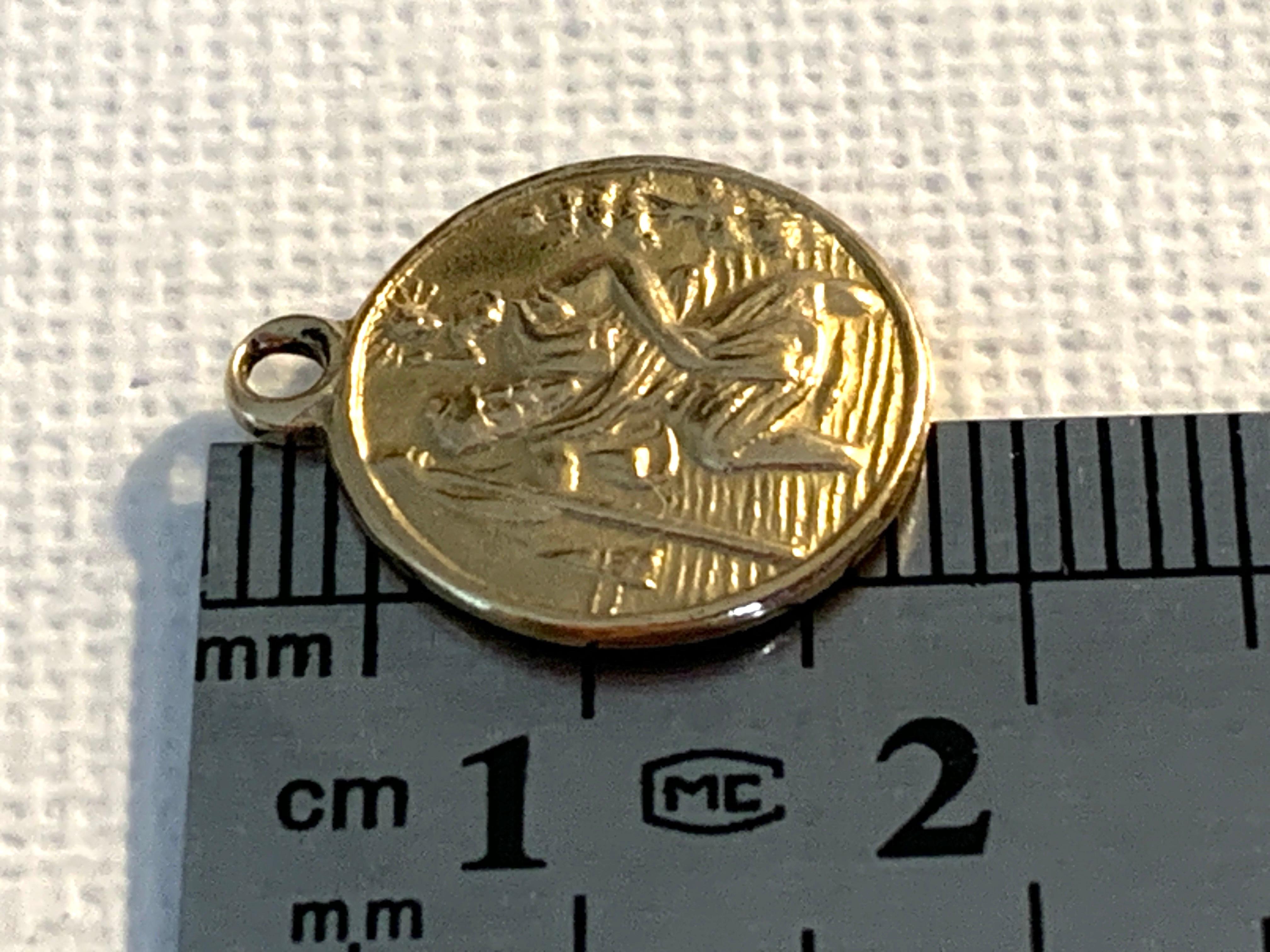 Oro 18ct 750
Ciondolo religioso di San Cristoforo
Con un'iscrizione datata sul retro
Peters