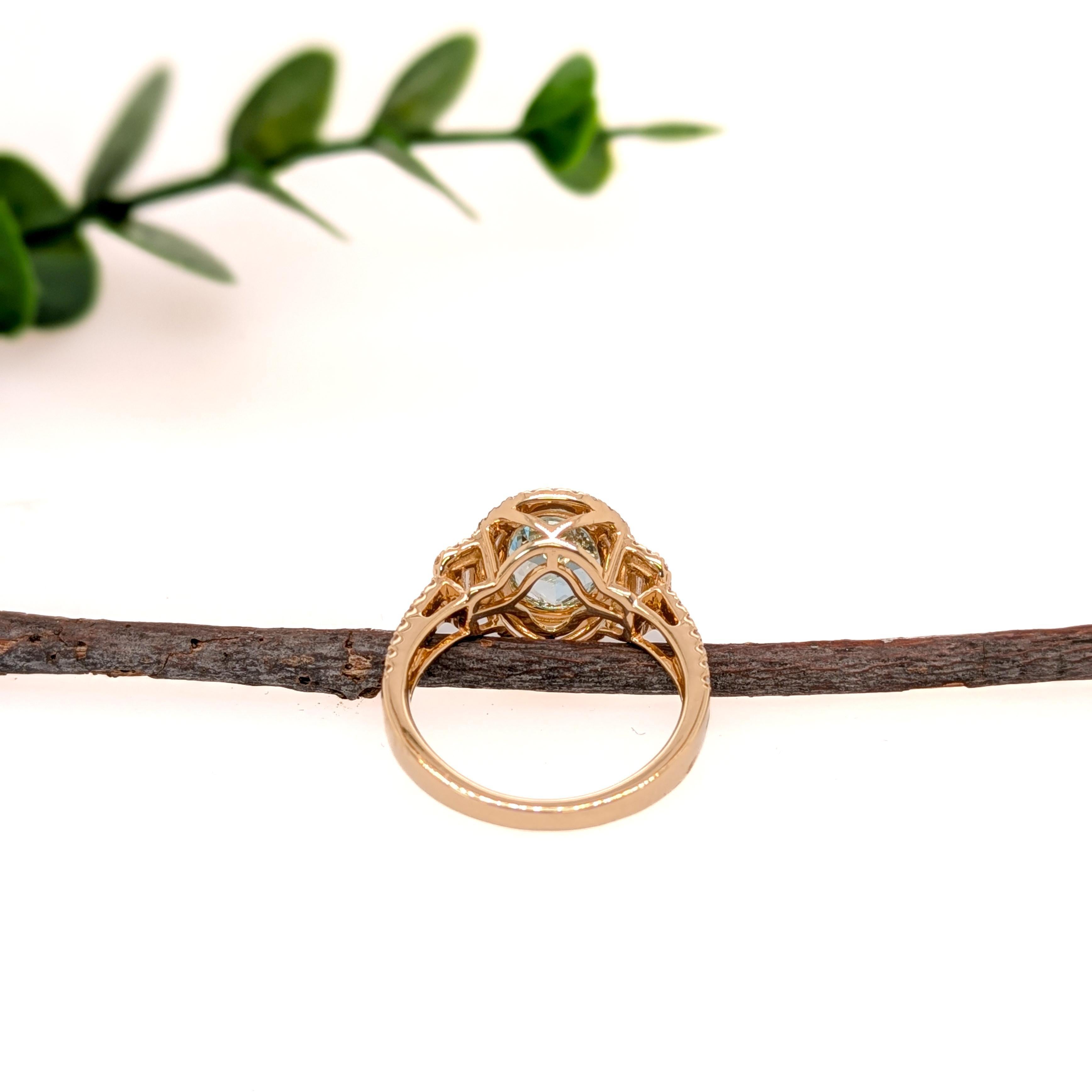 A sparkling 1.82 carat blue aquamarine in 14k yellow gold with a fancy all natural earth mined diamond halo. A statement ring design perfect for an eye catching engagement or anniversary. This ring also makes a beautiful March birthstone ring for