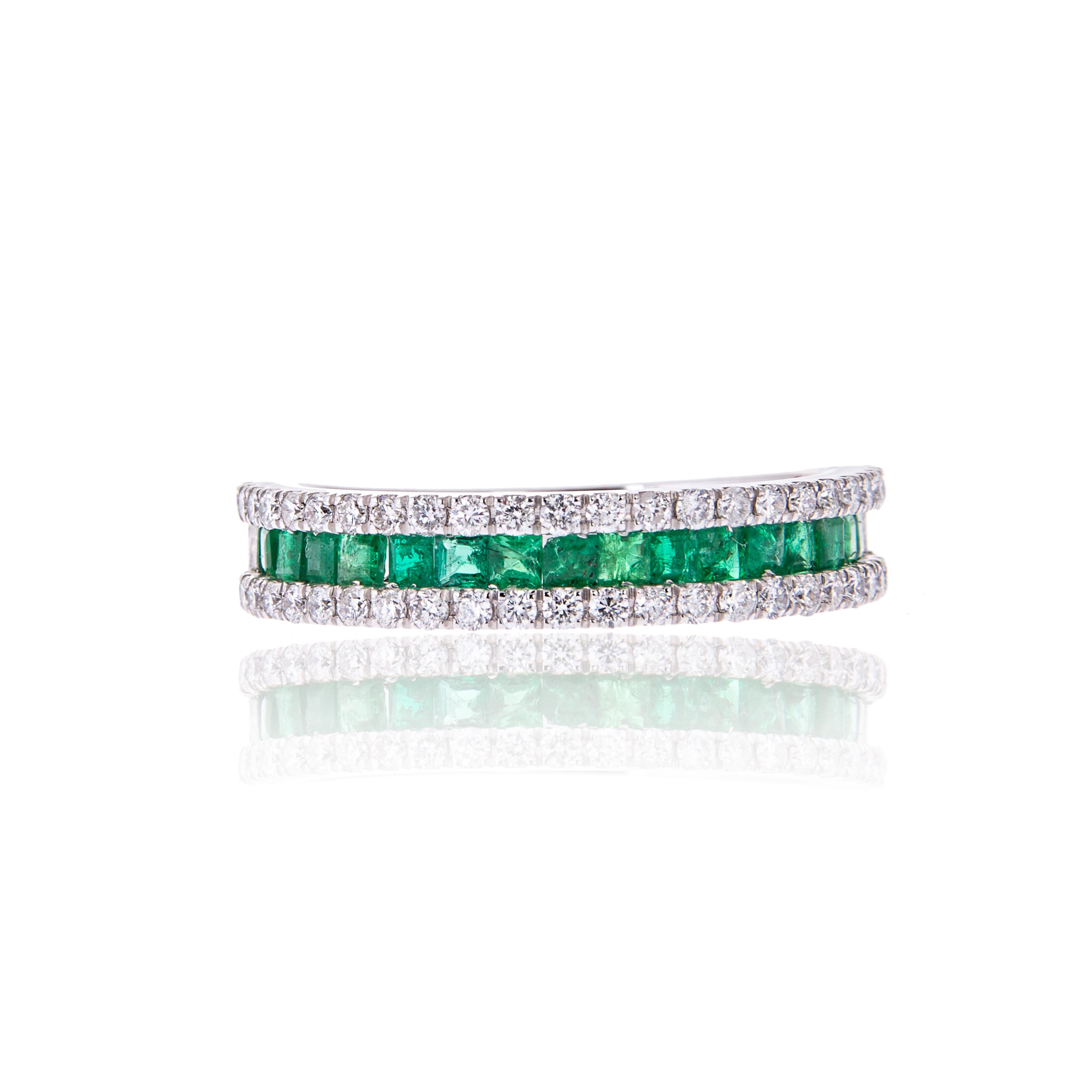 An elegant  emerald and diamond ring set in 18ct white gold.

Perfect gift to your lady love on her birthday or any special occasion

Diamonds: 0.50ct  
Colour and Clarity: F  SI

Emerald: 0.50ct

Metal Purity: 18ct white gold

British