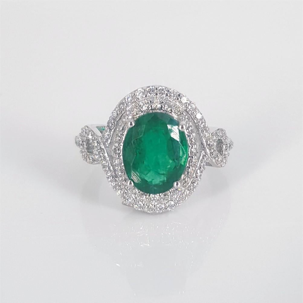 Modern 18ct Emerald & Diamond ring For Sale