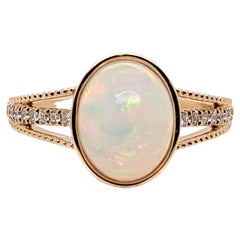 Anello con opale etiope 1,8ct e diamanti estratti dalla terra in oro massiccio 14K Ovale 10x8mm