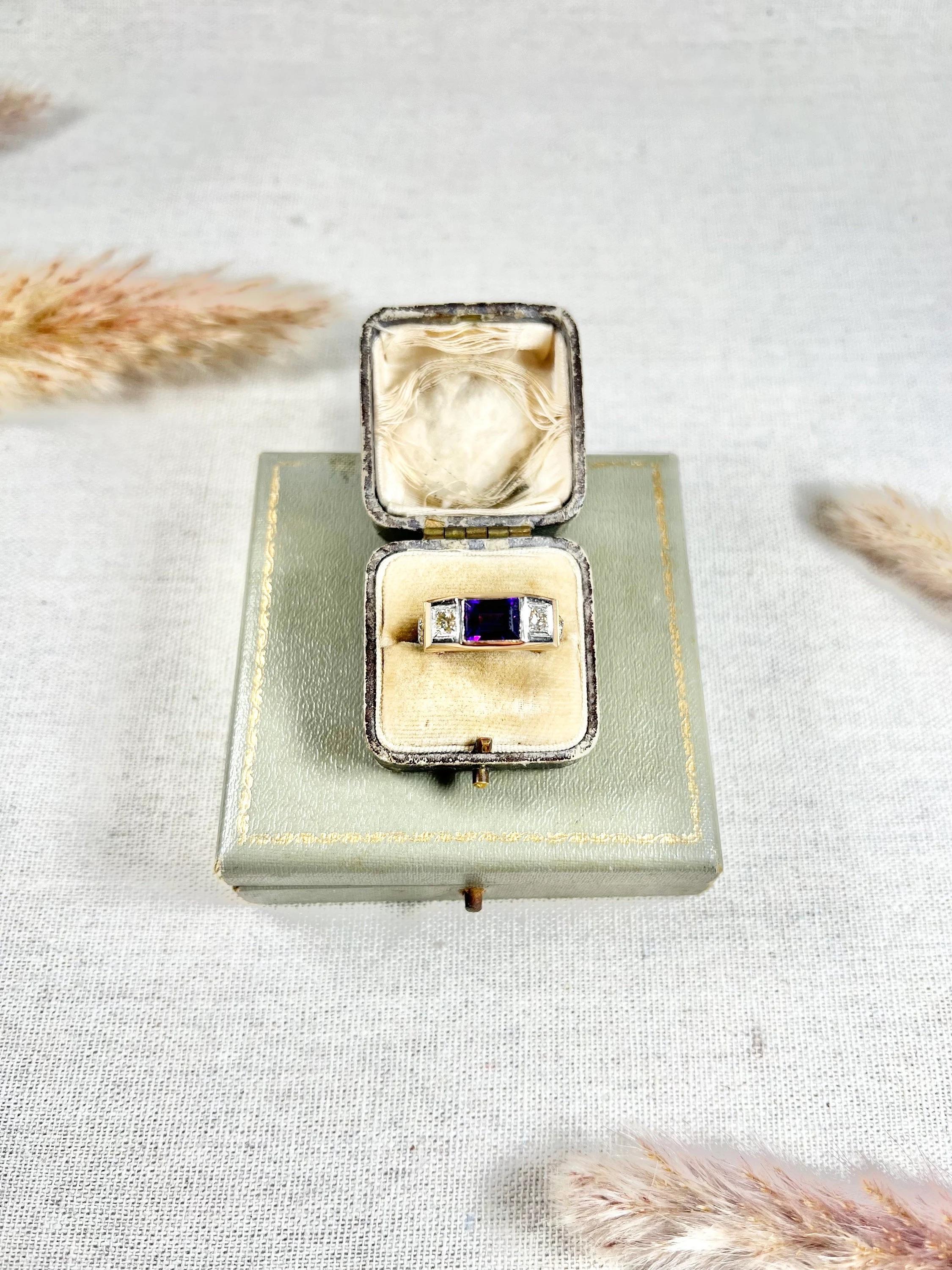 Vintage Fraternity Ring 

18ct Yellow & White Gold 

Circa 1950s

This beautiful 18ct two-colour gold geometric ring is a perfect example of a fraternity-style ring. The ring features a stunning emerald-cut amethyst stone in the centre, flanked by