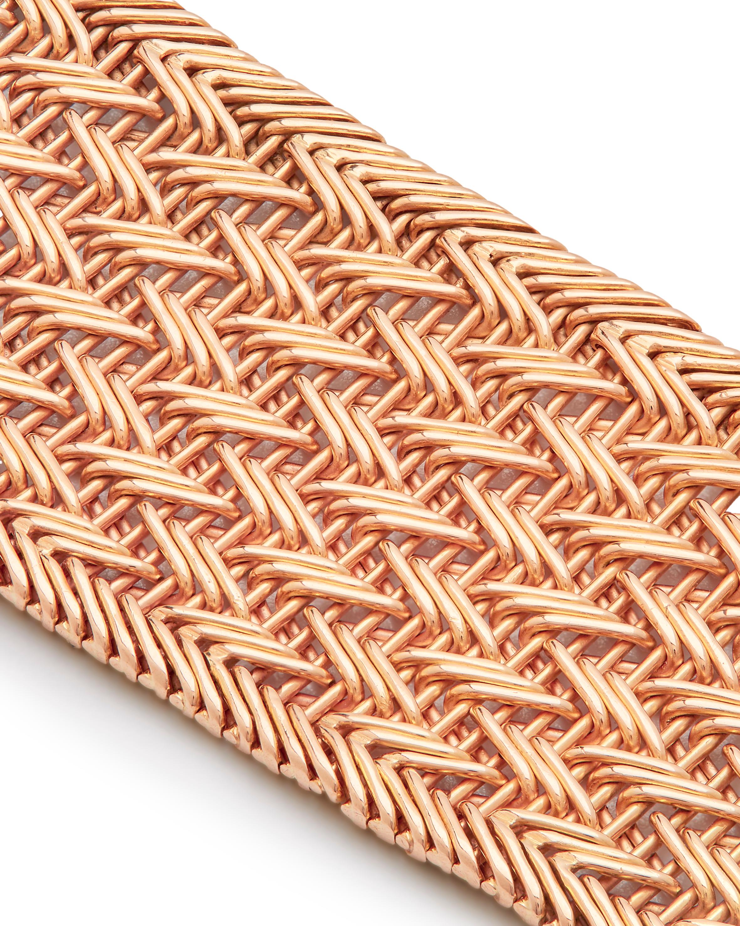 An 18ct gold and Platinum French Woven Gold Bracelet
The intricate mesh gold supple strap, to single-cut diamond foliate and bud design concealed clasp,

Elegant woven crossover work, Hand-made with Diamond-set in a leaf design, total diamond weight