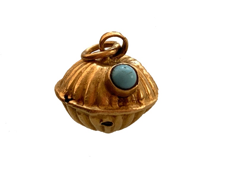 18ct 750 Gold Antique Egyptian Lantern Charm
Hollow - with a small turquoise cabochon
Stamped VI faintly on top
Size 12mm x 12mm x 10mm 
Total Weight 1.64 grammes 