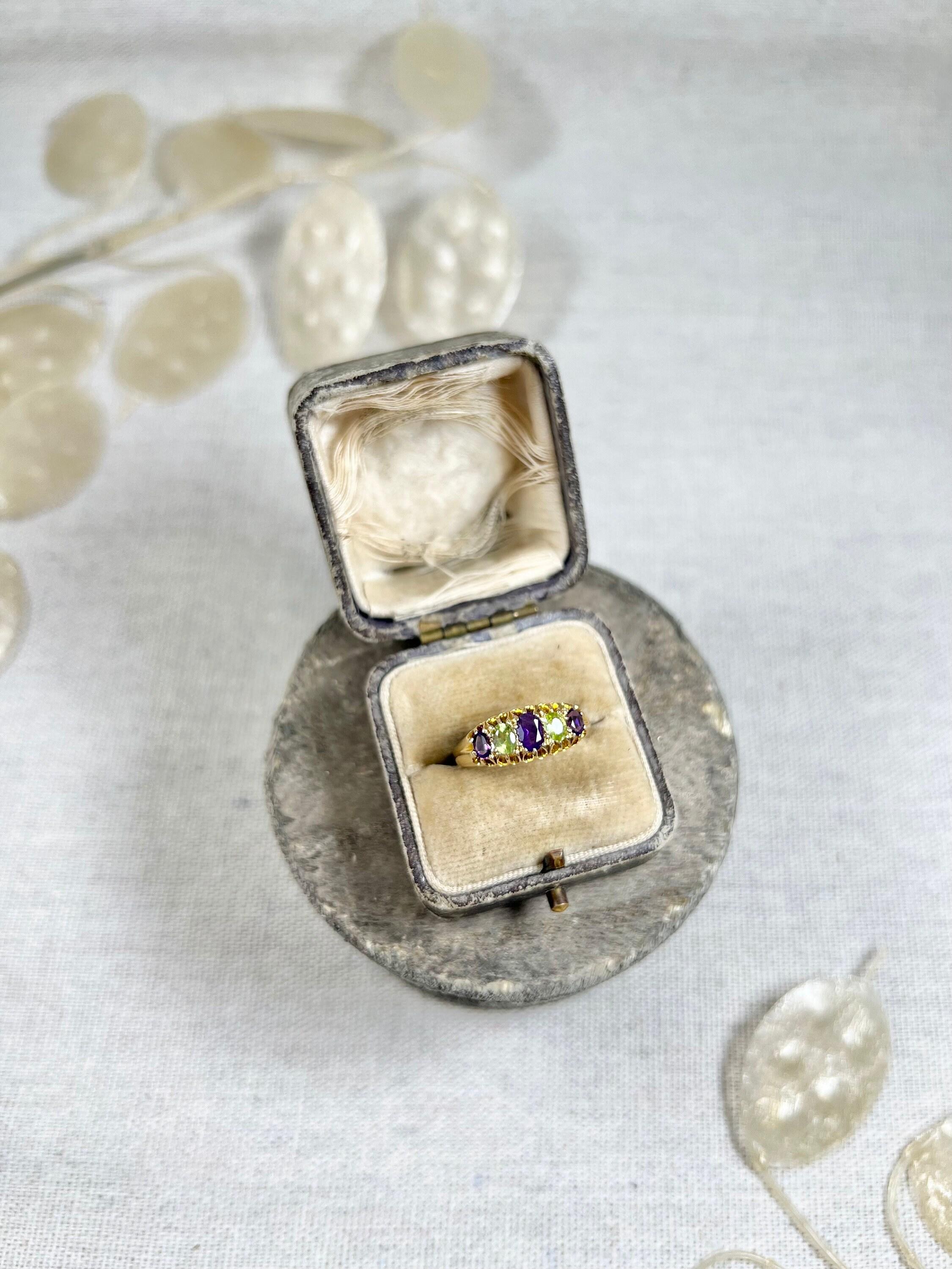 Antique Suffragette Ring 

18ct Gold Stamped

Hallmarked Birmingham 1906

Makers Mark A I 

This beautiful Edwardian suffragette ring is a true testament to the elegance and style of the era. Made from 18ct yellow gold, it features exquisite