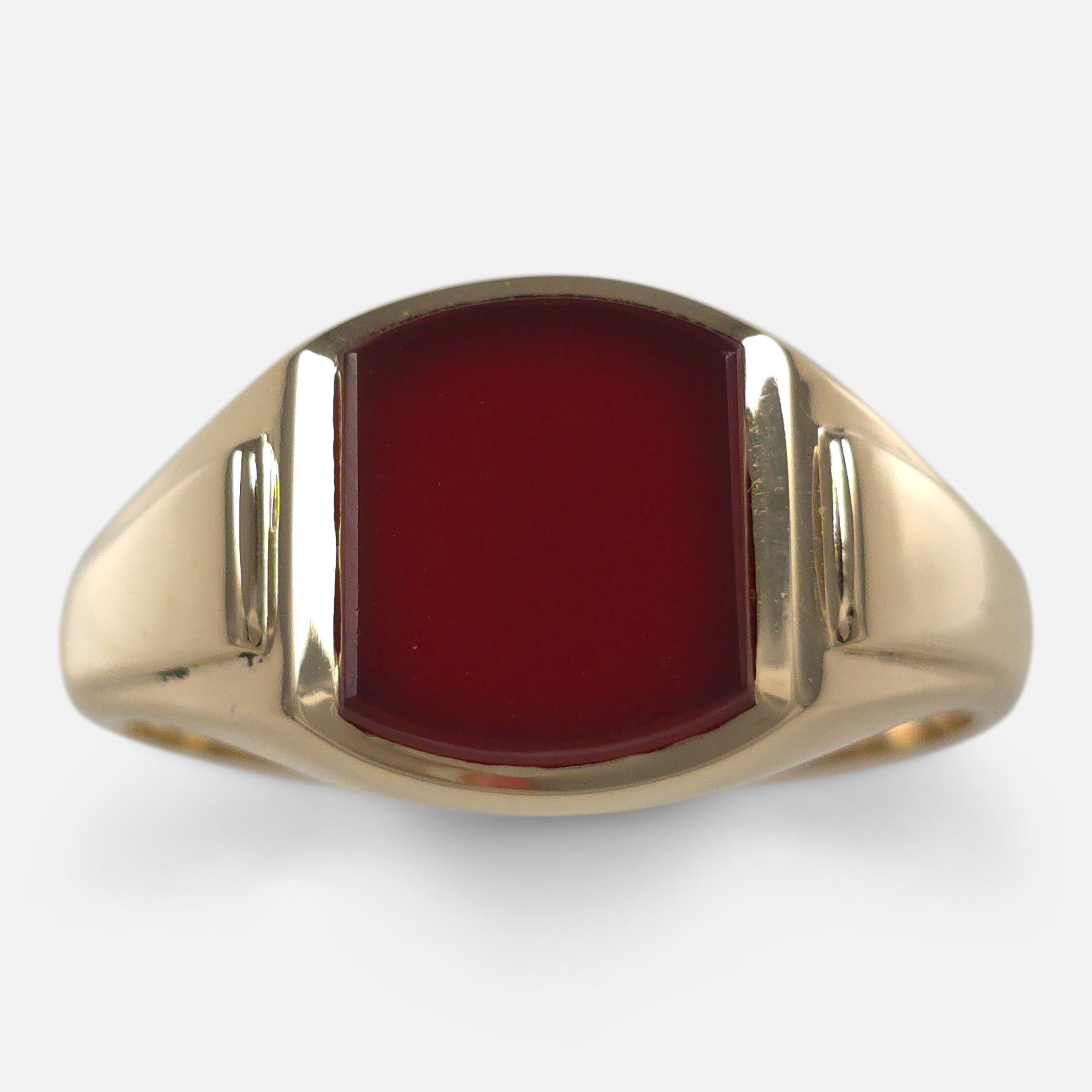 An 18ct yellow gold signet ring, unengraved, set with a carnelian. Hallmarked by the London assay office, marked '18' for 18 carat gold, with date letter 'C' for 1958.

• Period: Mid 20th Century
• Maker: W Wilkinson Ltd
• Measurement: UK ring size