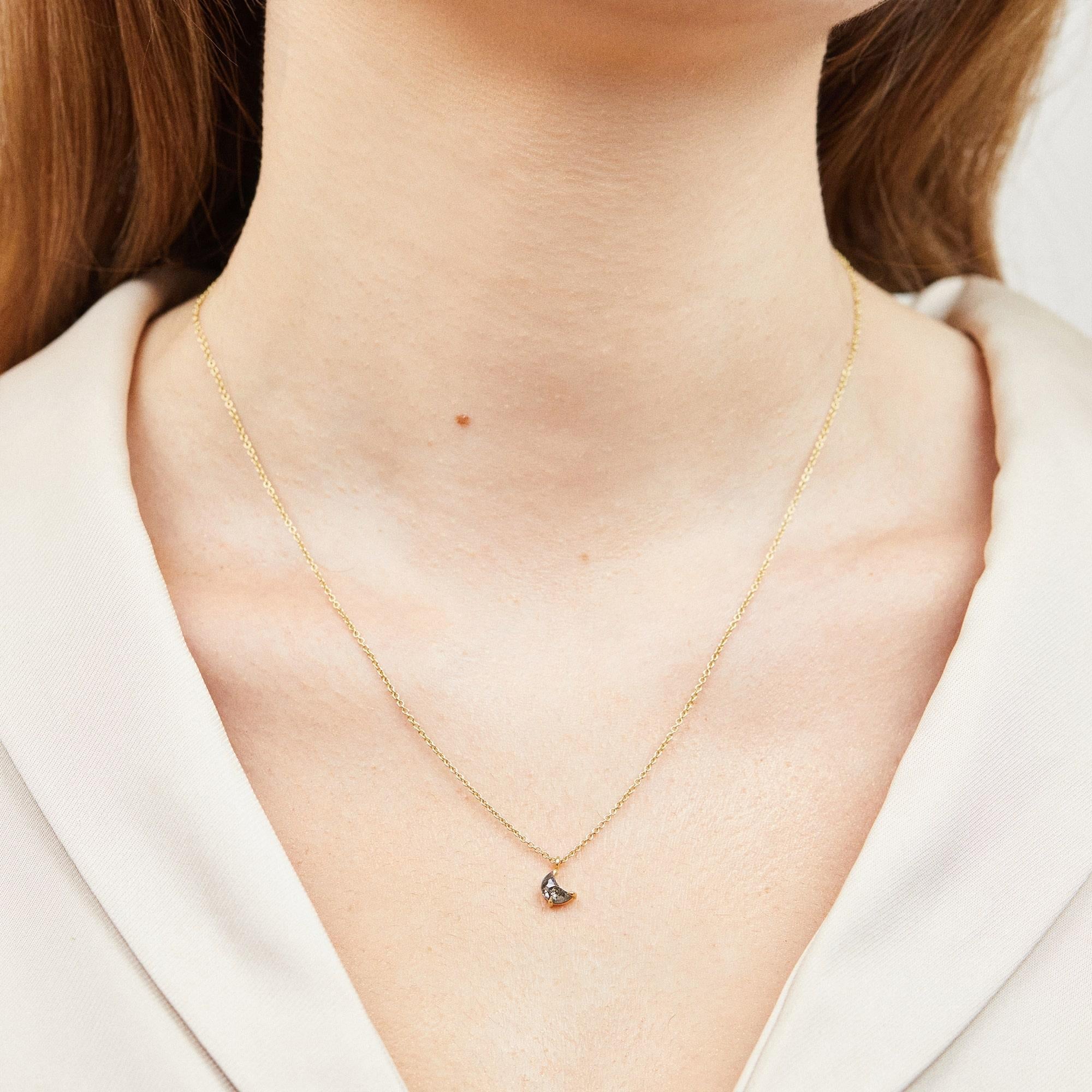 Stone
- Diamond
- Shape: Crescent moon
- Carat weight: 0.60
- Colour: Salt & pepper

Setting
- 18ct yellow gold
- 16 inch necklace chain

Shipping Information:
This necklace is ready to ship and can be delivered within 5 working days
If you would