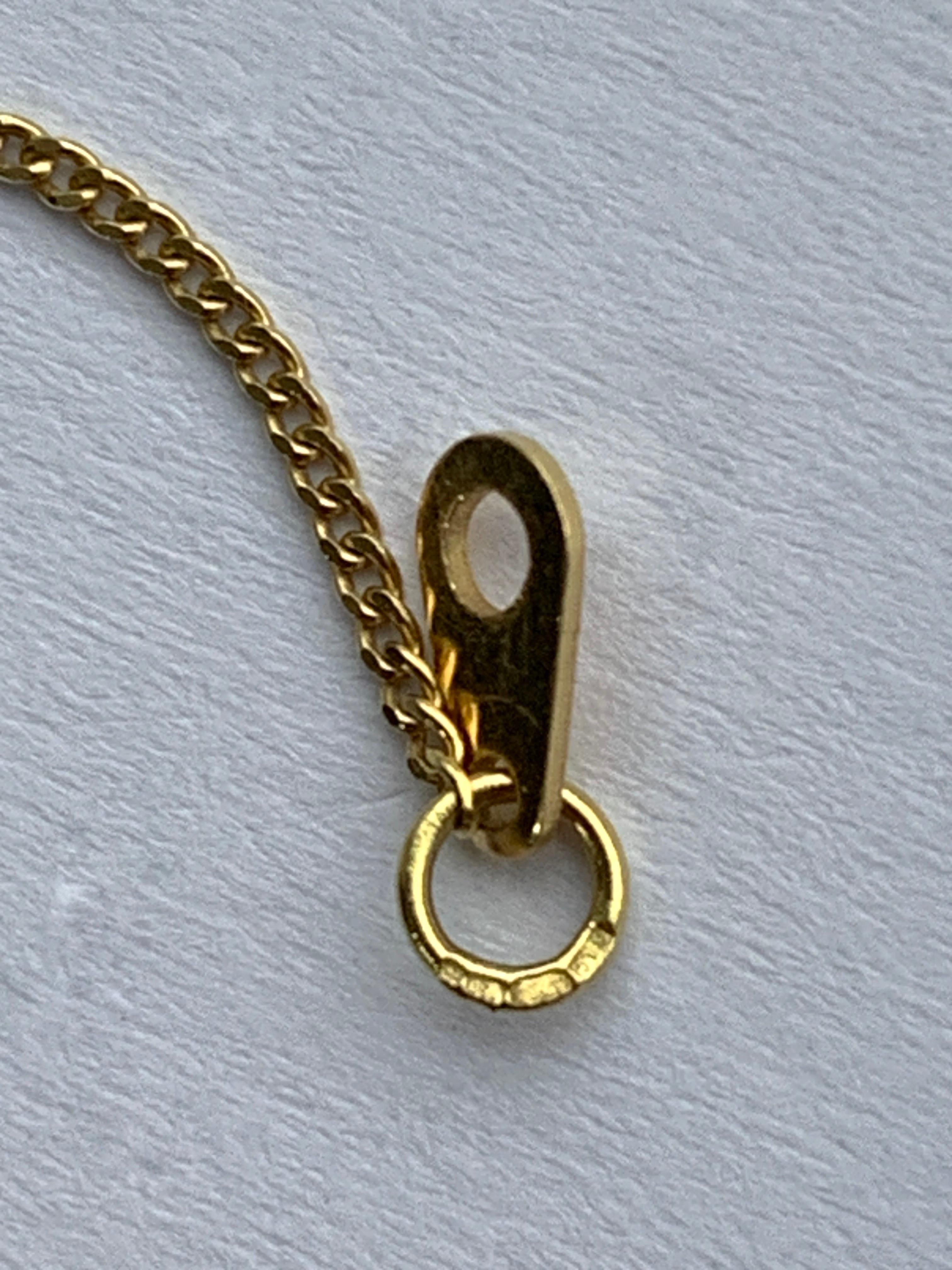 Croix en or 18ct avec diamant et chaîne de 16