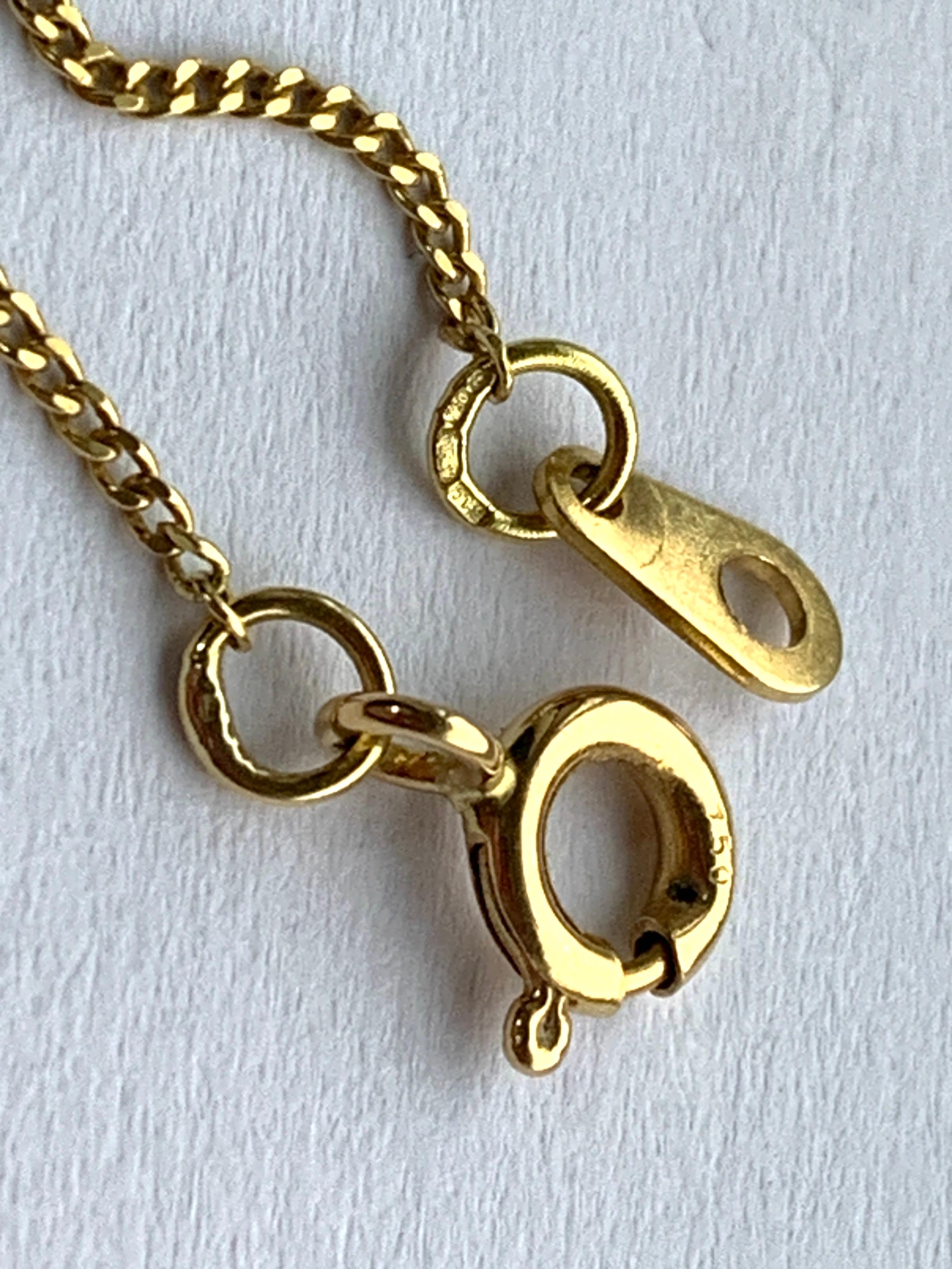 Croix en or 18ct avec diamant et chaîne de 16