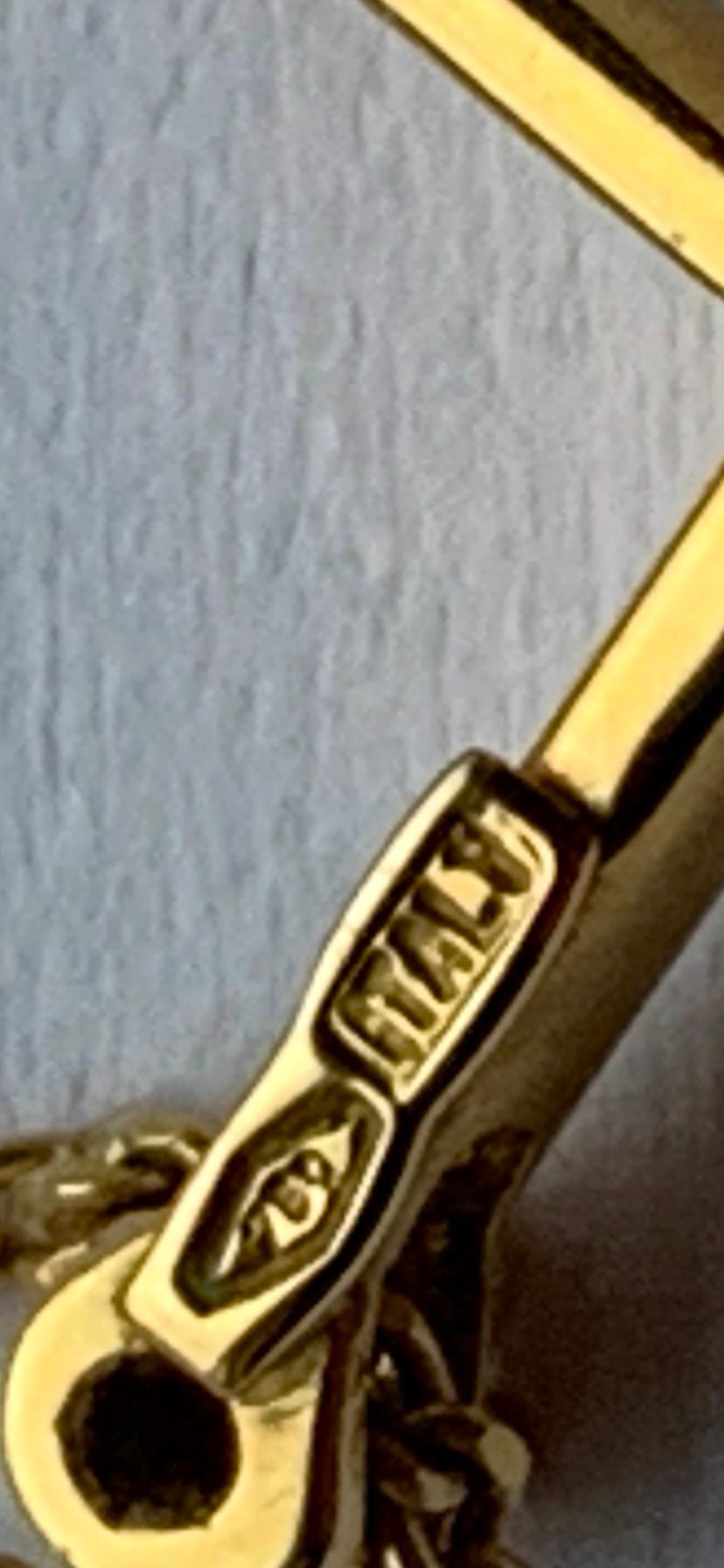 Croix en or 18ct avec diamant et chaîne de 16