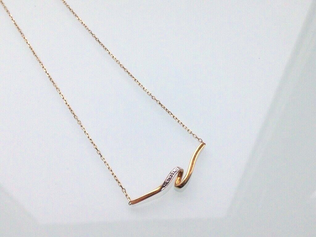 Beautifully Feminine Italian
Fine 18ct Gold necklace by unknown designer 
please see images 
finished with a teeny diamond (1mm) set in white gold 
stamped 750 in three places 