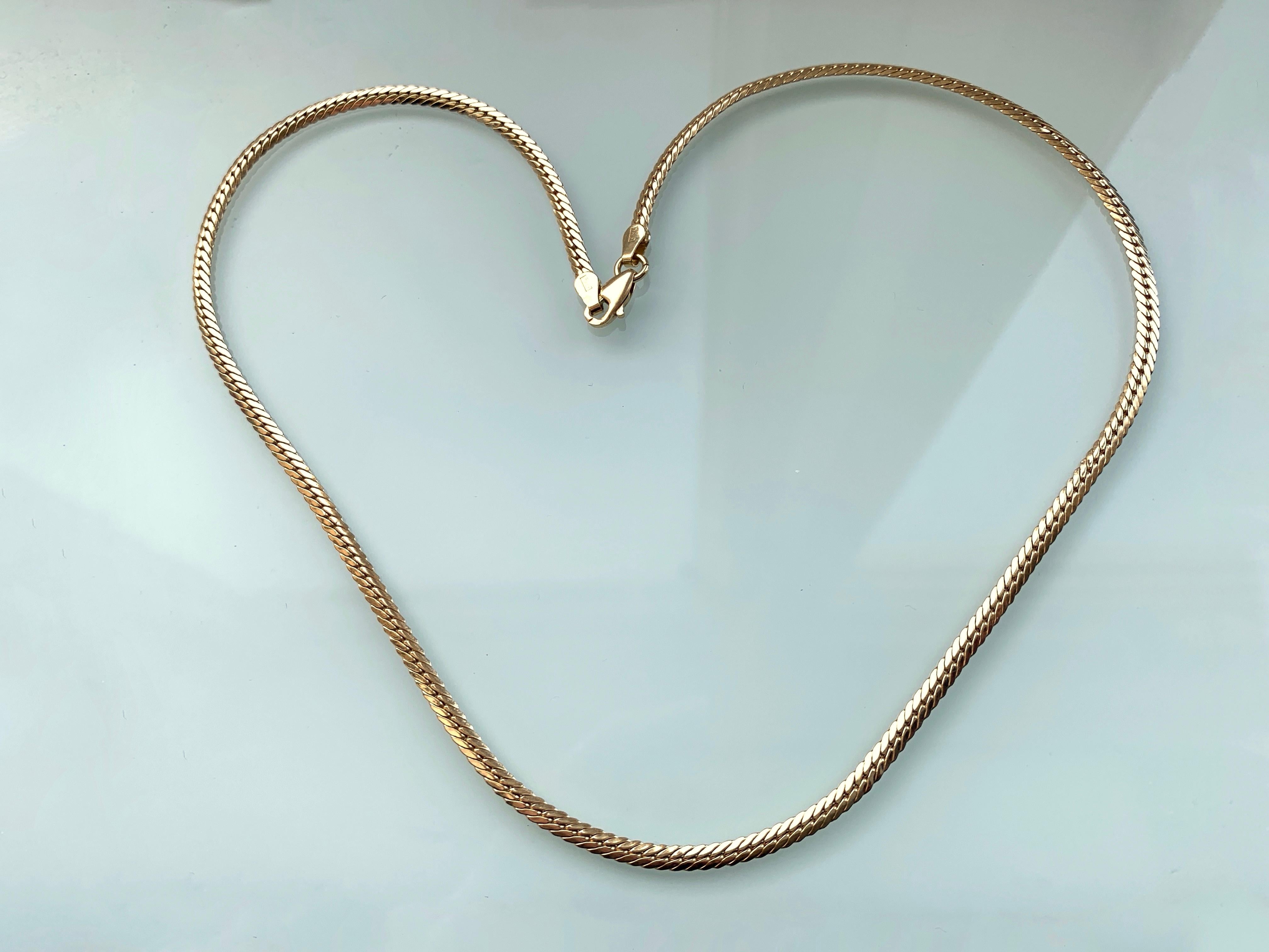 Stunning Flat Snake necklace 
which is 18ct Gold 
made in Egypt exported to Italy
gorgeously luxurious and smooth 
has Egyptian marks which are makers & 18ct Gold stamps
Length 17 Inches 
Thickness 3mm