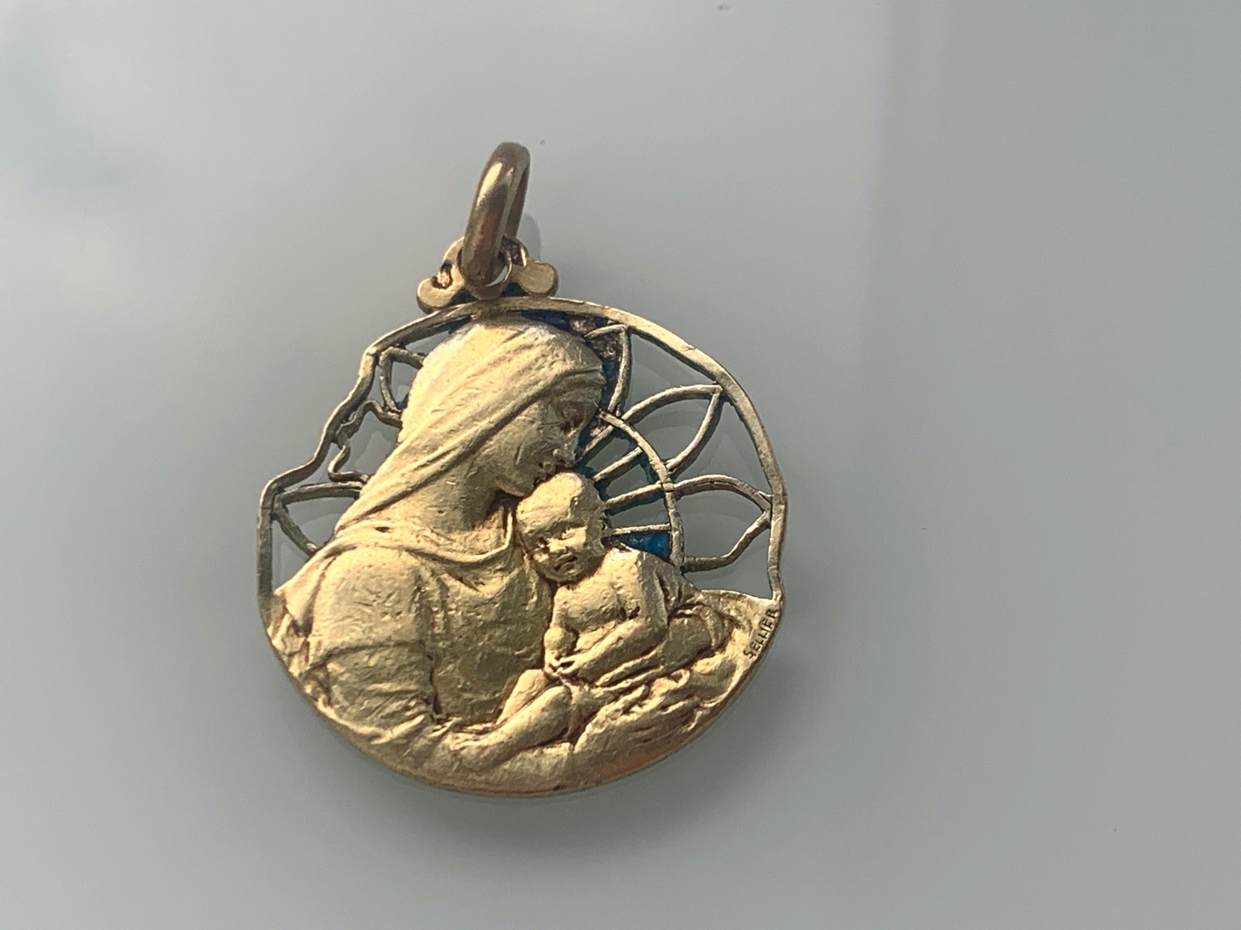 Antique Circa 1880s
French Art Nouveau Artist Sellier Pendant
Signed Sellier
18ct 750 Solid Gold Religious pendant 
depicting Mary & Jesus
Stamped with French  Eagle Mark for 18ct Gold 
Condition :
Unfortunately the blue enamel has all gone.
Weight