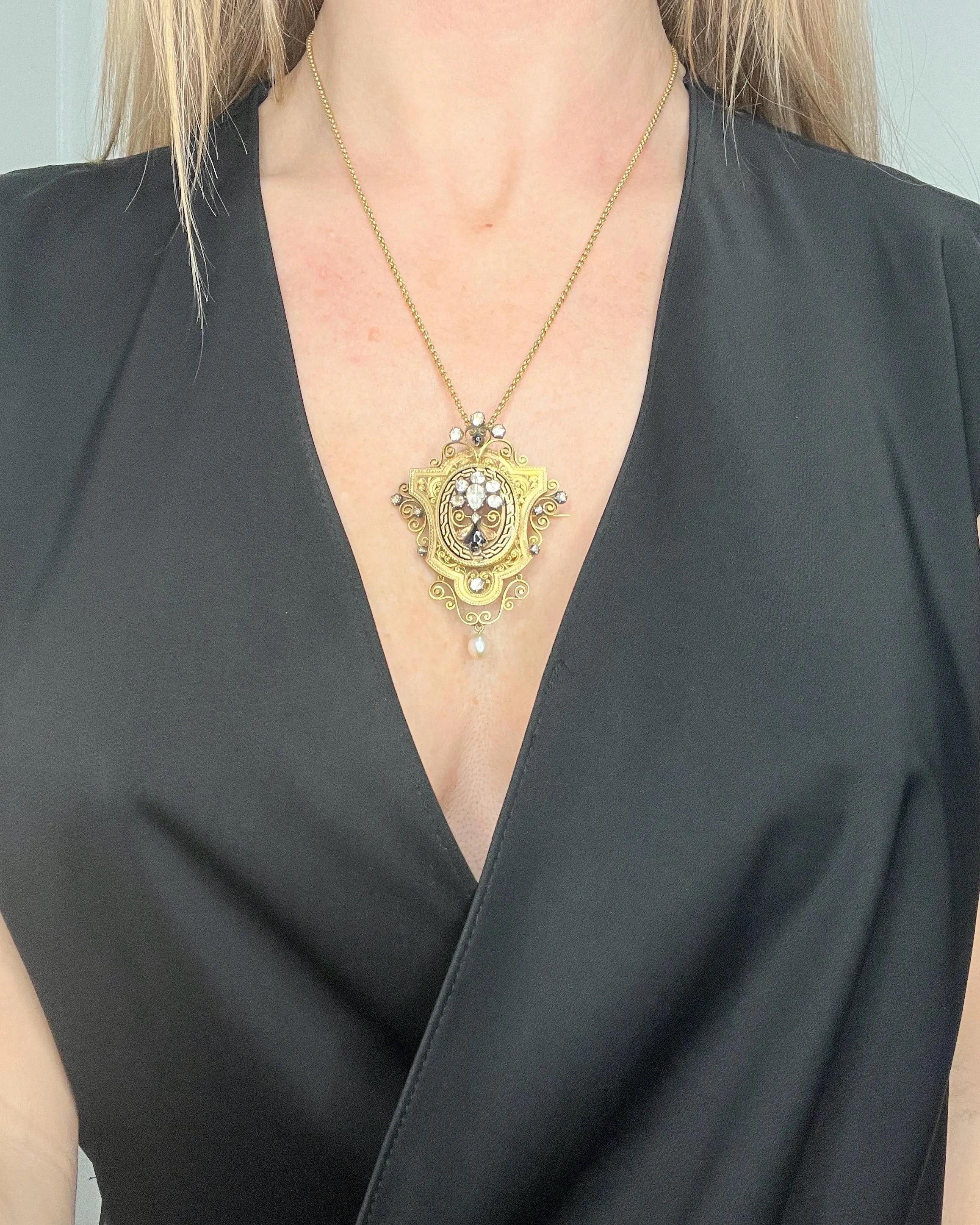 Antique Brooch/Pendant 

18ct Gold French

Circa 1850

* THE CHAIN IS SOLD SEPARATELY 

Step back in time with this stunning Early Victorian-era brooch, meticulously crafted to showcase exquisite artistry and luxury. This ornate piece features