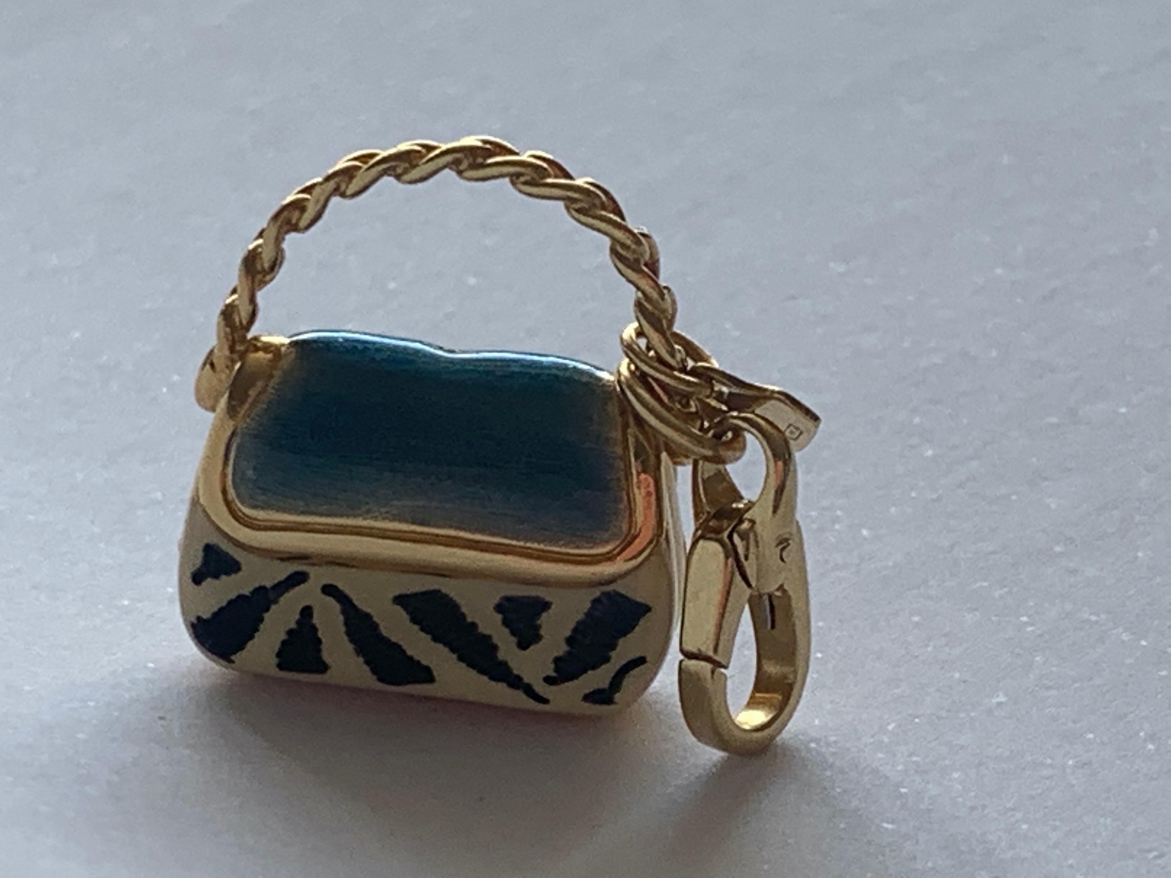 Pretty Enamelled 18ct Gold Charm
By Italian Jeweller Rosato
Enamelled Airforce blue top and Zebra stripes Black & Cream 
Hollow Charm 
Weight 4.85 grammes