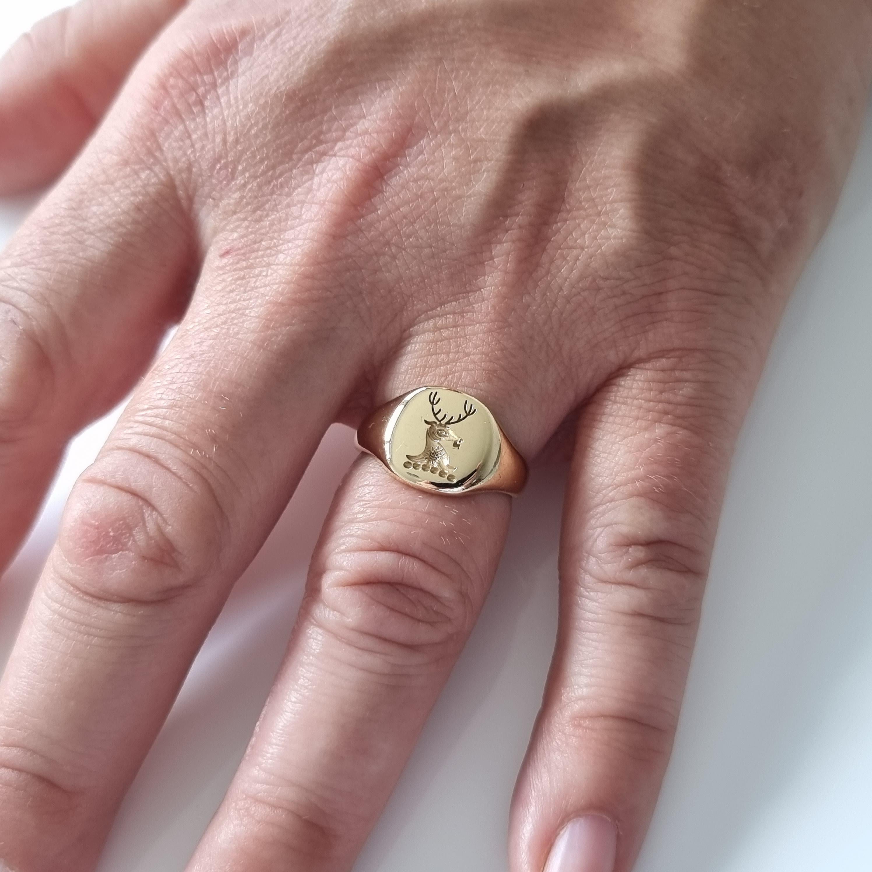 An 18ct yellow gold intaglio signet ring. The ring is engraved with a family crest.

The ring is hallmarked with Birmingham assay marks, date letter 'P' to denote 1964, and stamped '18' for 18 carat gold.

Period: - Mid 20th century.

Date: -