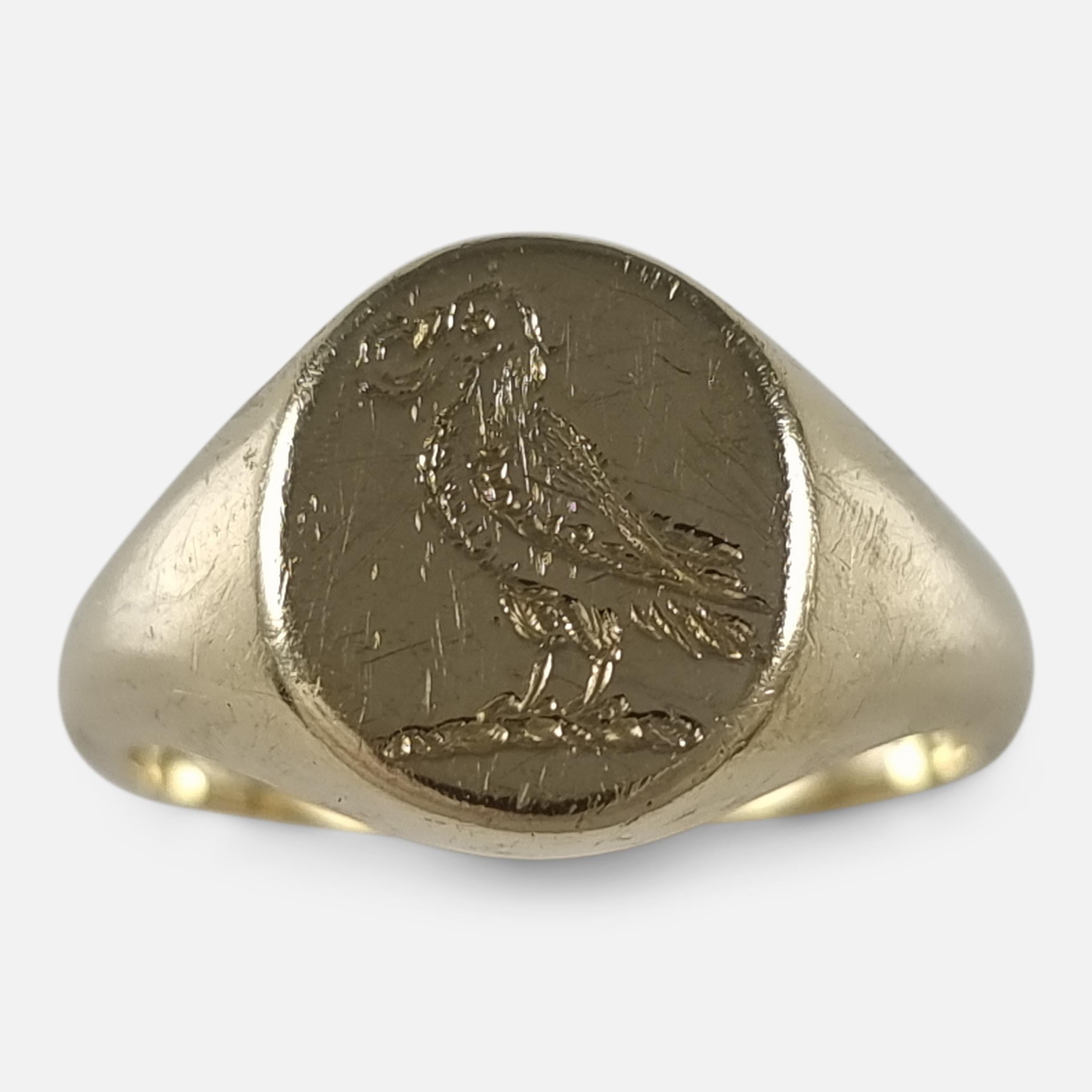 An Elizabeth II 18ct yellow gold signet ring. The signet ring is of oval form to the head with engraved intaglio family crest of a parrot, holding an annulet in its beak, leading to a plain shank.

The ring is hallmarked with Birmingham assay office