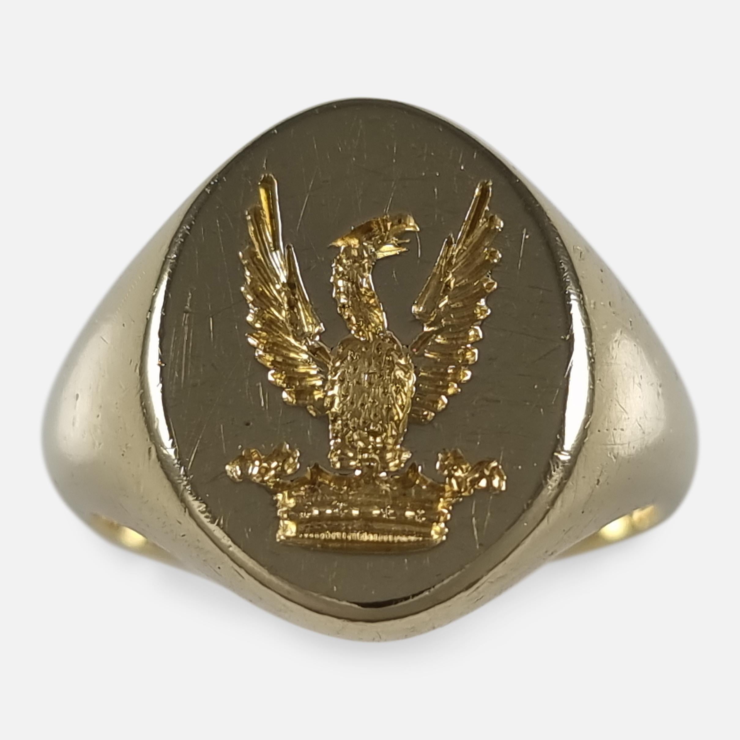 An Elizabeth II 18ct yellow gold signet ring. The signet ring is of oval form to the head with engraved intaglio of a bird above a coronet, and plain shank.

The ring is hallmarked with Birmingham assay office marks, the date letter 'O' to denote