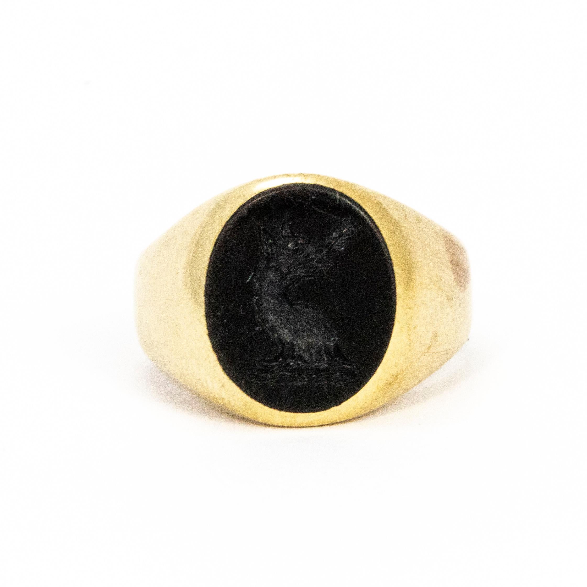 Engraved into the deep glossy onyx there is a detailed dragon holding an arrow in its mouth. The band is made out of 18ct gold.

Ring size: J 1/2 or 5