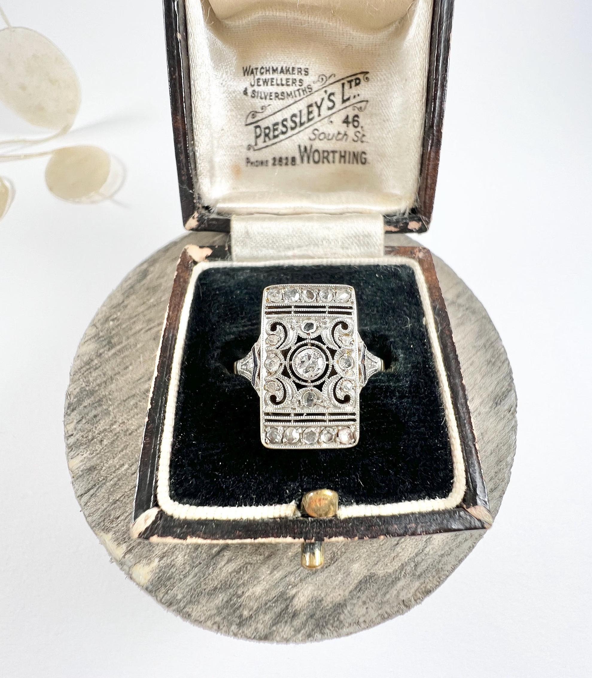 Antique Diamond Ring

18ct Gold & Platinum Tested

Circa 1920s

This exquisite art deco ring features a fabulous and intricate open-work design with a centre bezel-set Old European Cut diamond and a wonderful array of milgraine-set Rose Cut diamonds