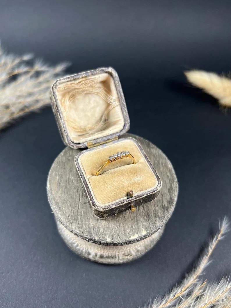 Antique Diamond Ring 

18ct Gold & Platinum Stamped 

Makers Mark R N 

This Edwardian 5-stone diamond ring is a true masterpiece of art and craftsmanship. The diamonds are beautifully set in a platinum rub-over setting, which not only enhances the