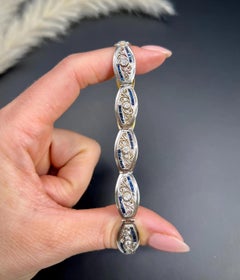 Armband aus 18 Karat Gold und Platin mit edwardianischem Calibrated Saphir und Diamanten im Altschliff