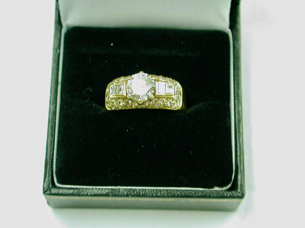 Women's 18ct Gold Ring Set with 1 Carat Diamond Centre Stone and a Cluster of Diamonds For Sale