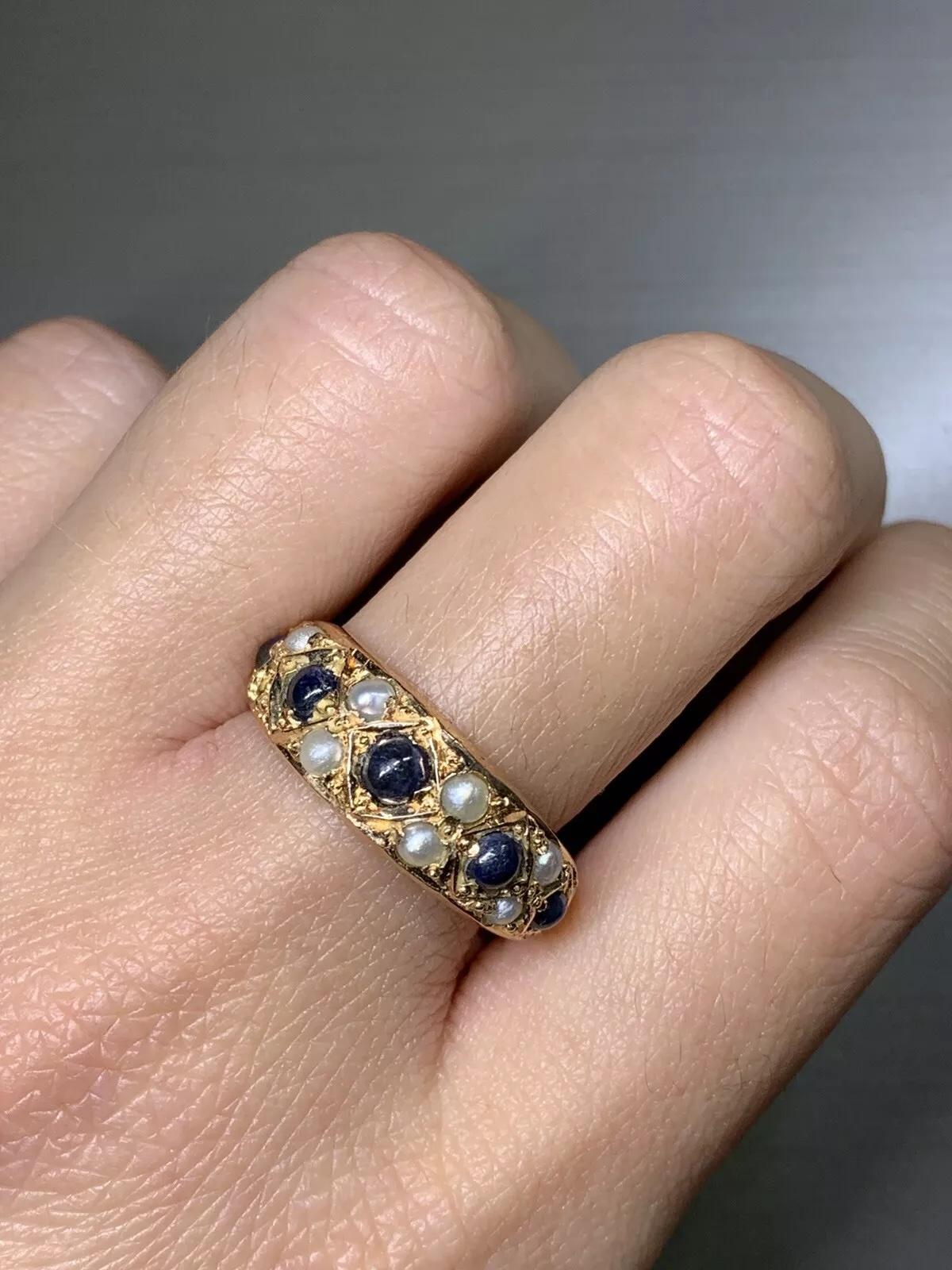 18ct Gold Sapphire And Pearl Victorian Antique Engagement Ring Rose Gold.

Sapphire cabochon round shaped total weight 0.65ct

18ct rose gold chunky sapphire and pearl antique ring.

Sapphire untreated blue colour.

Cultured pearl round shaped cream