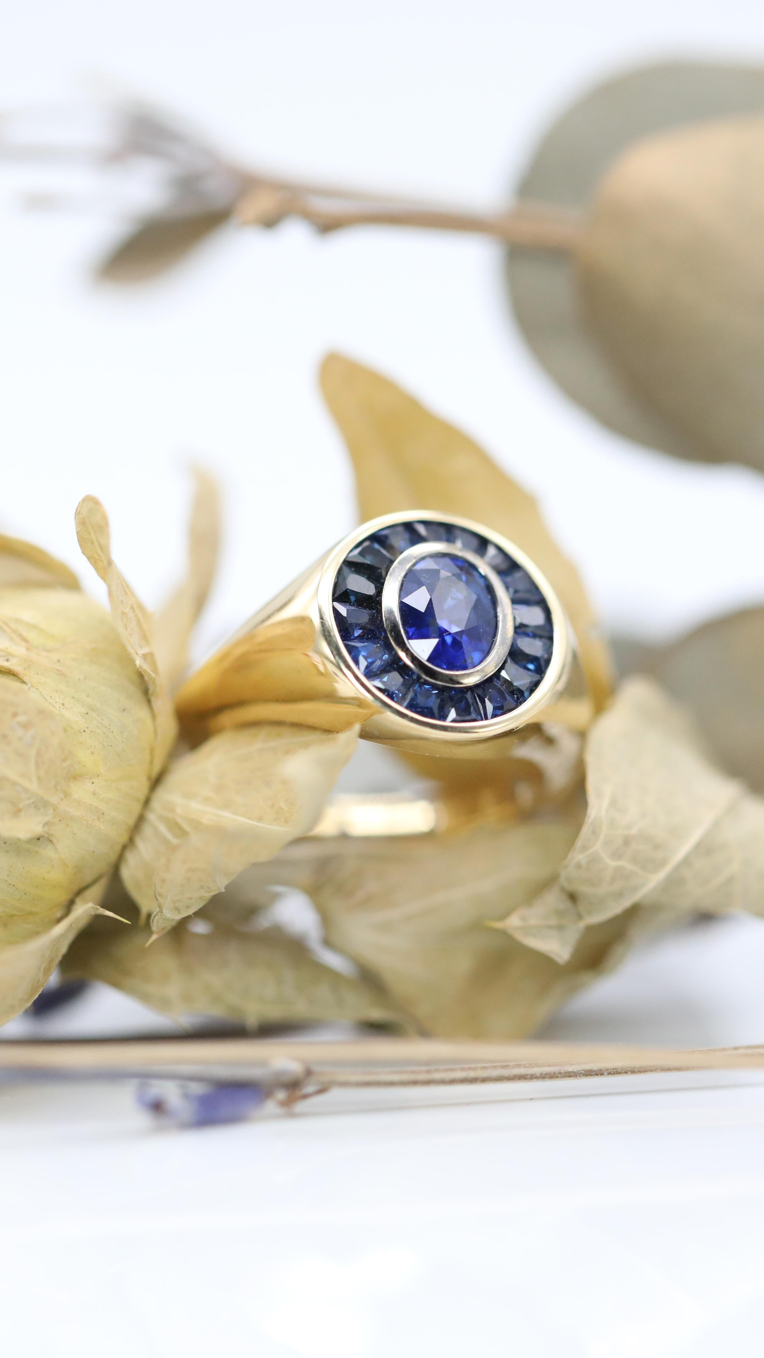 This ring is one of a kind.

18ct yellow gold band with a 1.12ct natural unheated certified Sri Lankan sapphire surrounded by hand-cut sapphire halo.