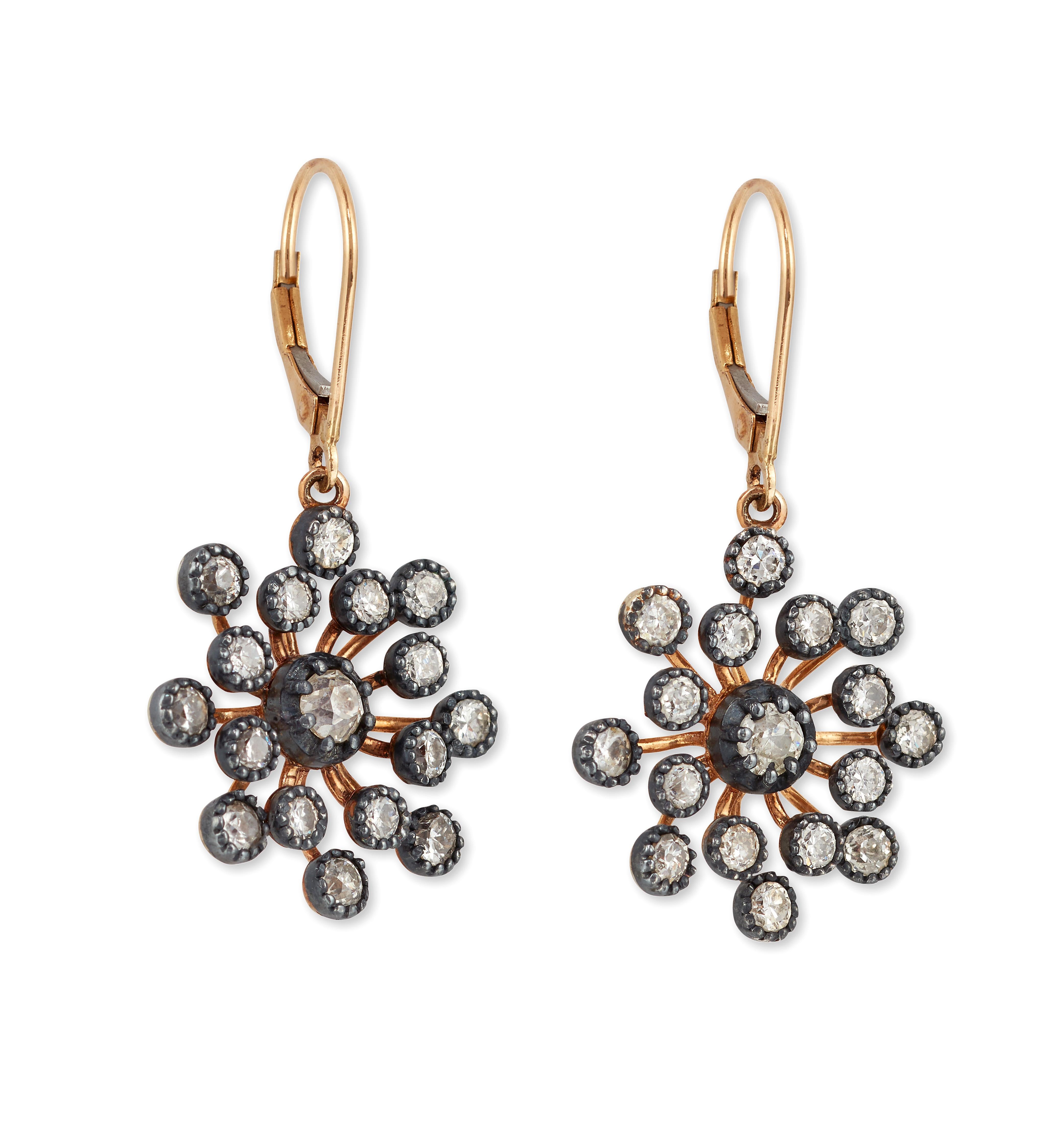 Beautiful large pair of Snowflake Diamond earrings.

Each composed of a double row old old-cut Diamonds mounted in Silver and 18ct yellow gold. with hook fittings.