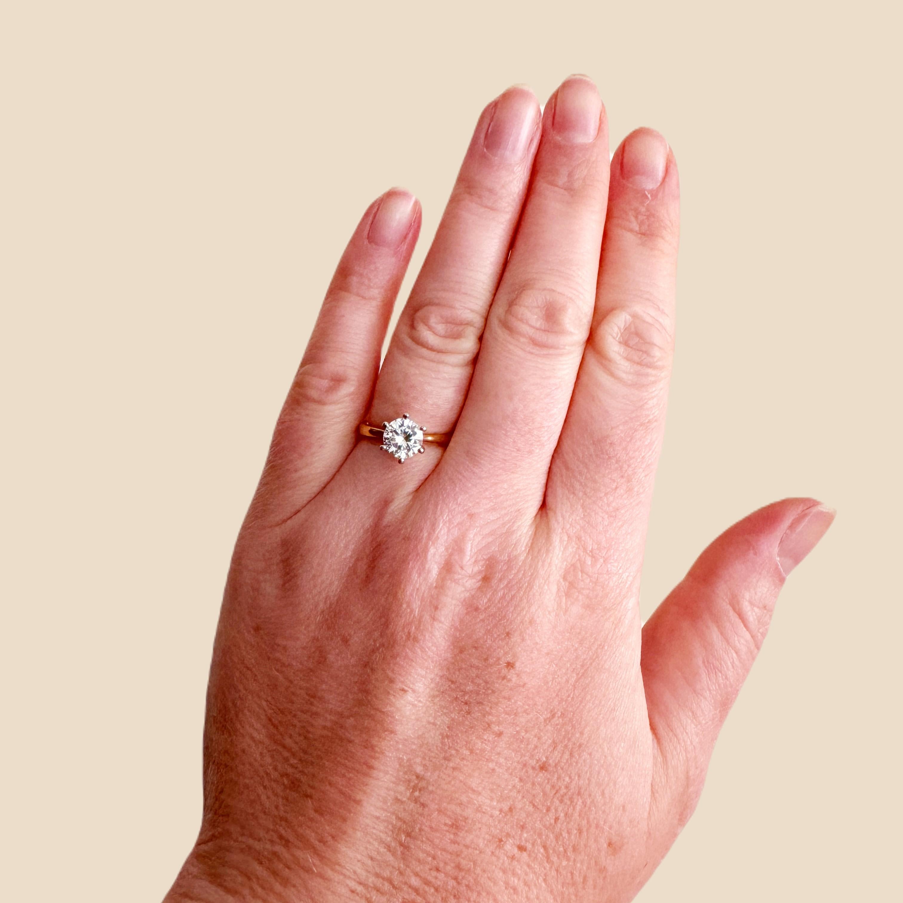 A single stone diamond ring will always remain a classic style.
This beautiful engagement ring has a 0.60ct natural mined diamond which a round brilliant cut, E colour, and VS clarity certified by GIA,
The diamond is set with 6 prongs or claws