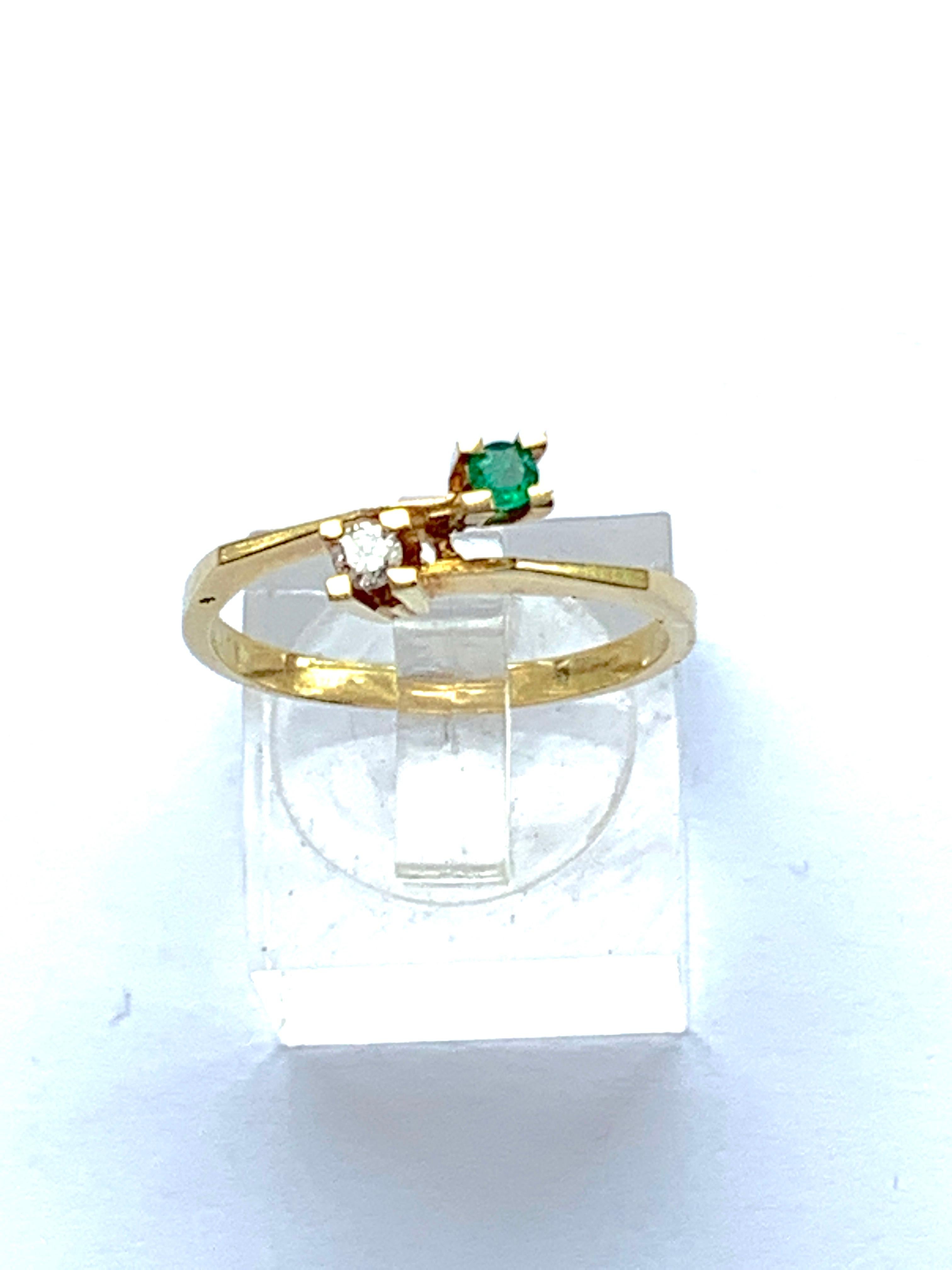 Mid Century Circa 1950s
18ct 750 Gold Ring
Marked 18k
with High Quality Stones

With Tension set Natural Diamond & Natural Emerald
Each stone measure approx 2mm
The Diamond is cut as a solitaire
The Emerald has a flat base.

Inner diameter is