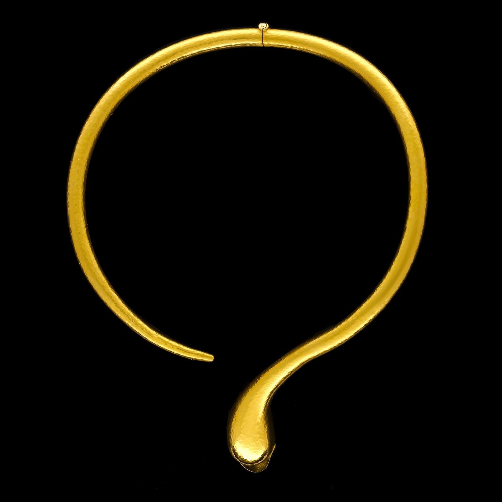 An elegant and stylish gold swan necklace by Lalaounis c.1970s, the necklace is part of the collection 'Between Luristan and Persepolis' and is designed as a smooth tactile rounded torque open at the front, one end terminating in a swan’s head and