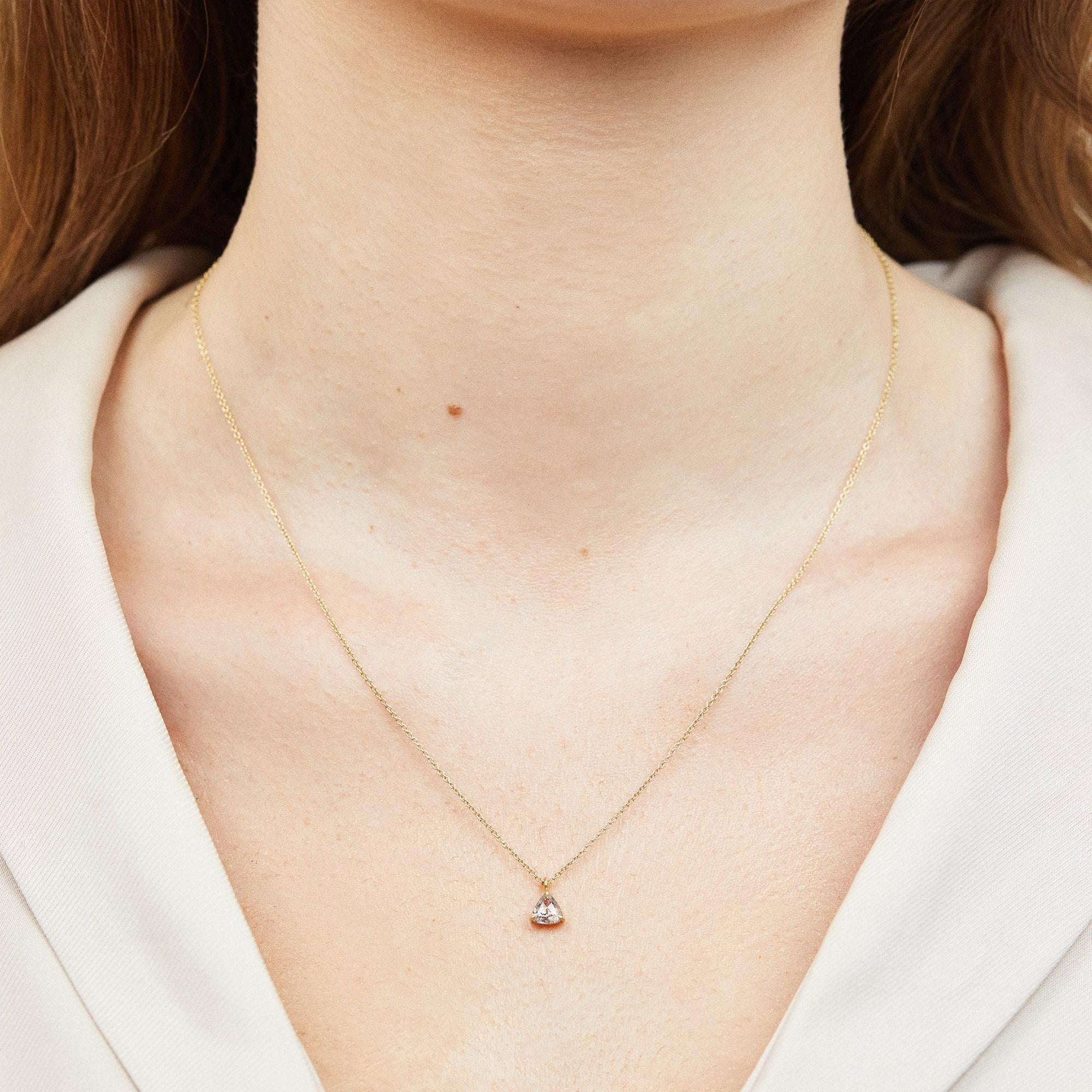 Stone
- Diamond
- Shape: Triangle, Rose-cut
- Carat weight: 0.39
- Colour: Transparent salt & pepper

Setting
- 18ct yellow gold
- Fifteen round diamonds
- 16 inch necklace chain

Shipping Information
This necklace is ready to ship and can be