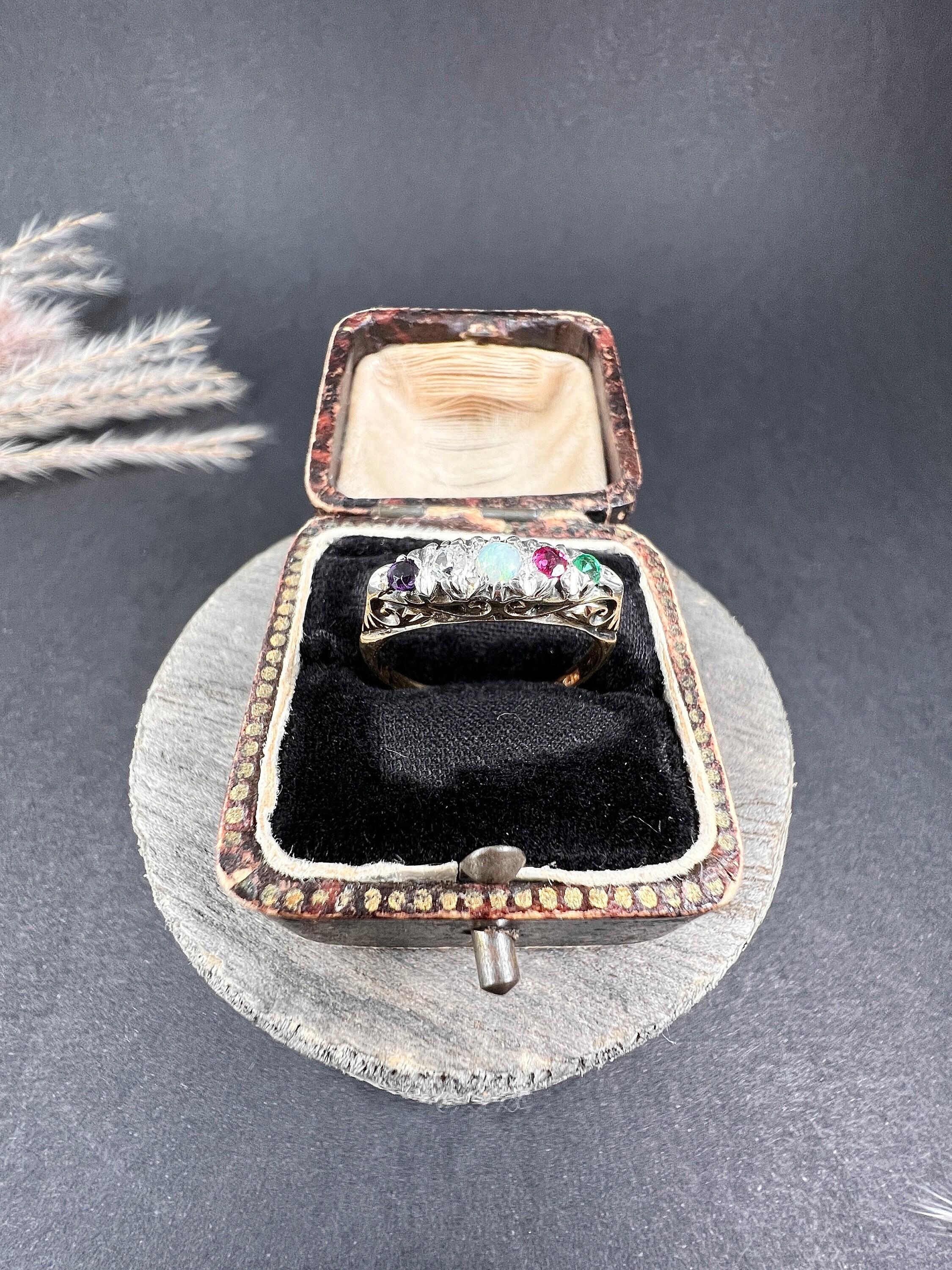 Antique Adore Ring 

18ct Yellow Gold Stamped

Makers Mark CS * FS

Introducing this stunning 18ct Yellow Gold Vintage ADORE ring, a true epitome of elegance and charm. This fabulous Victorian acrostic ring features enchanting Amethyst, dazzling